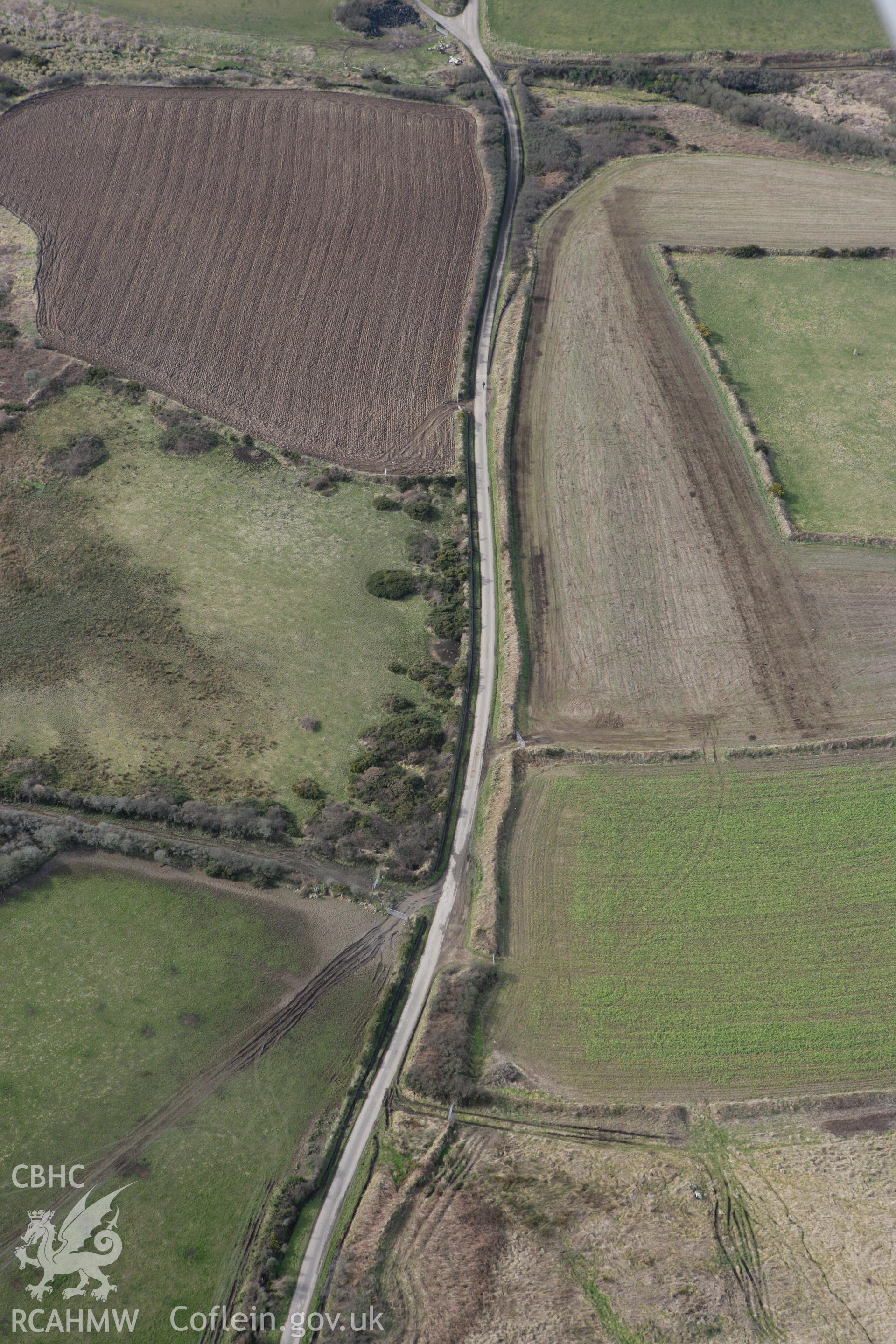 RCAHMW colour oblique aerial photograph of Ffos y Mynach, St Davids. Taken on 02 March 2010 by Toby Driver