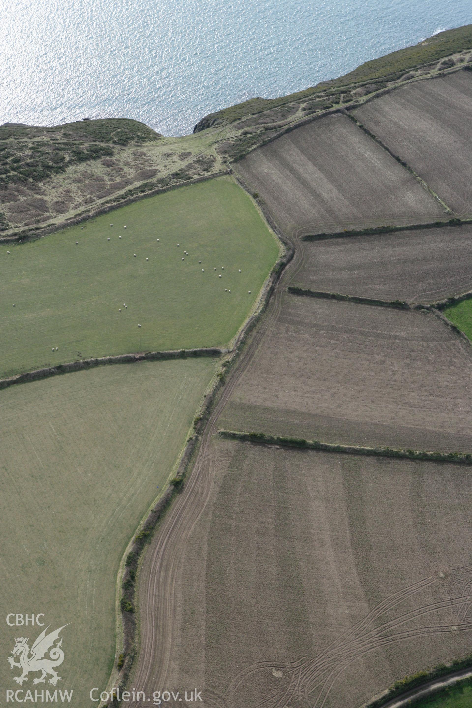 RCAHMW colour oblique aerial photograph of Ffos y Mynach, St Davids. Taken on 02 March 2010 by Toby Driver
