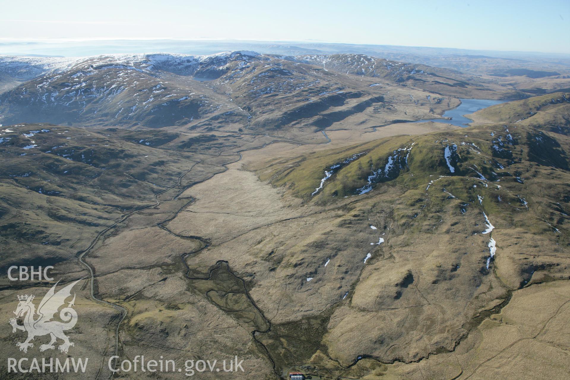 RCAHMW colour oblique photograph of Hyddgen lead mine, with Nant y moch reservoir, from the north. Taken by Toby Driver on 08/03/2010.