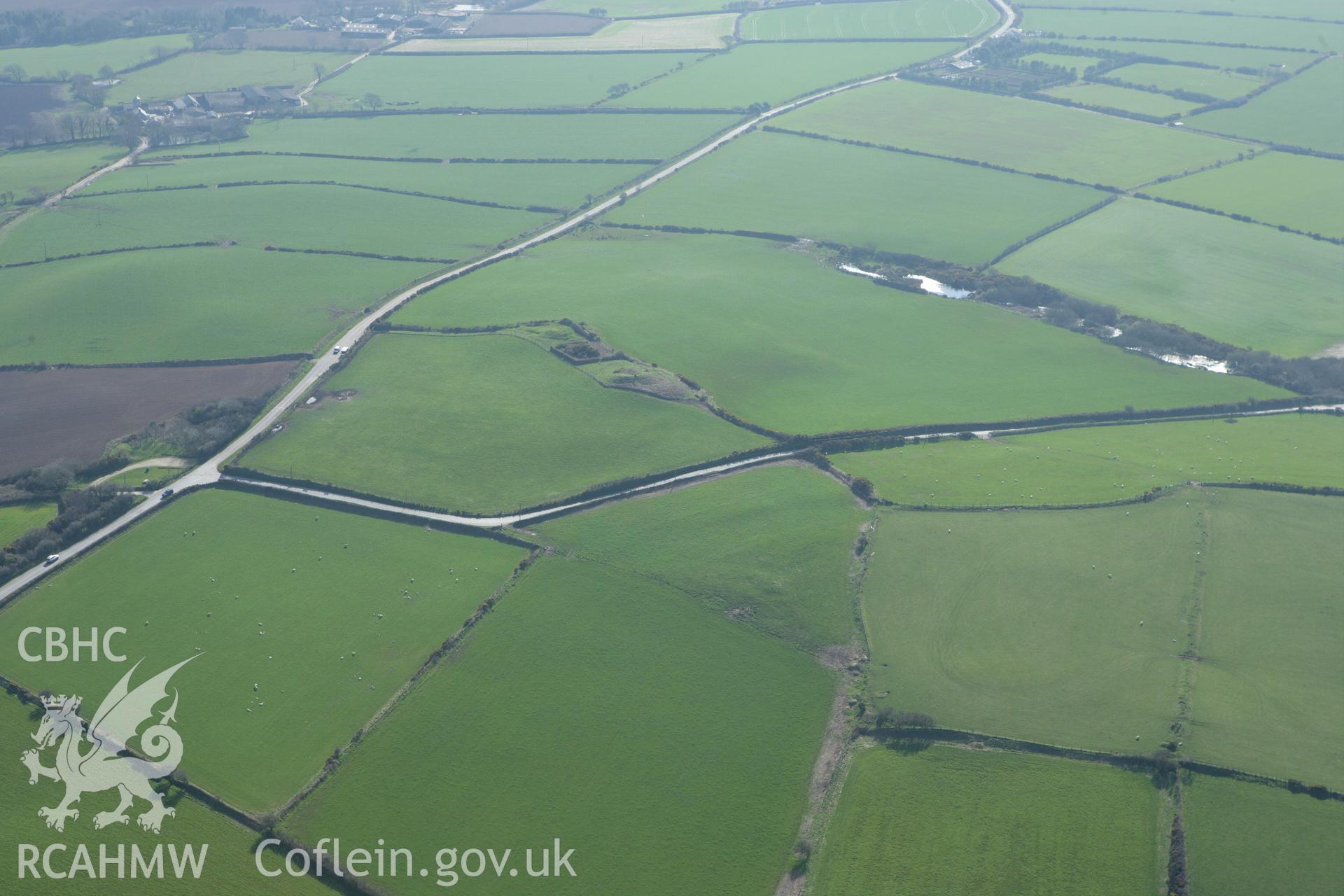 RCAHMW colour oblique aerial photograph of Crugiau Cemaes Barrow III. Taken on 13 April 2010 by Toby Driver