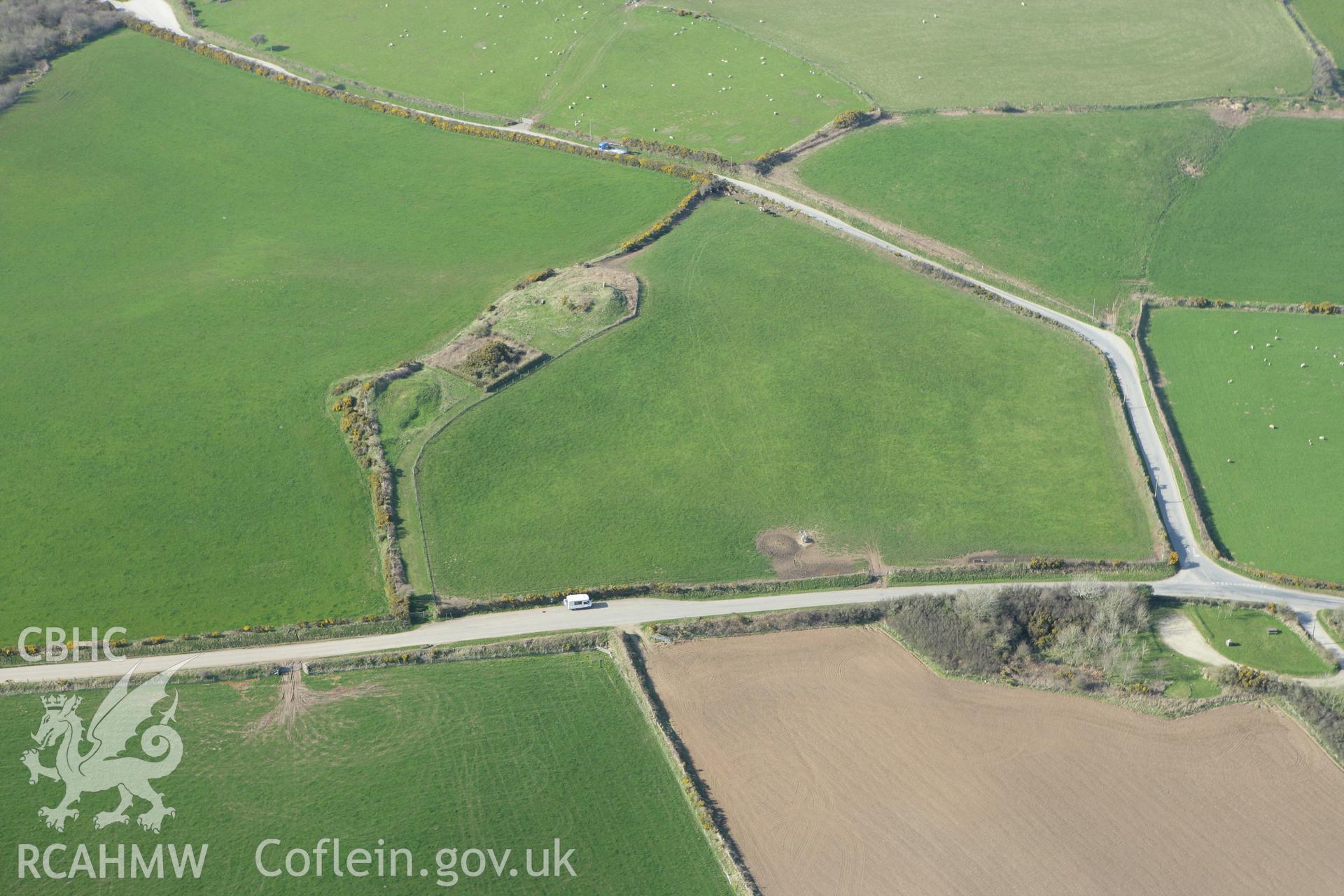RCAHMW colour oblique aerial photograph of Crugiau Cemaes Barrow II. Taken on 13 April 2010 by Toby Driver
