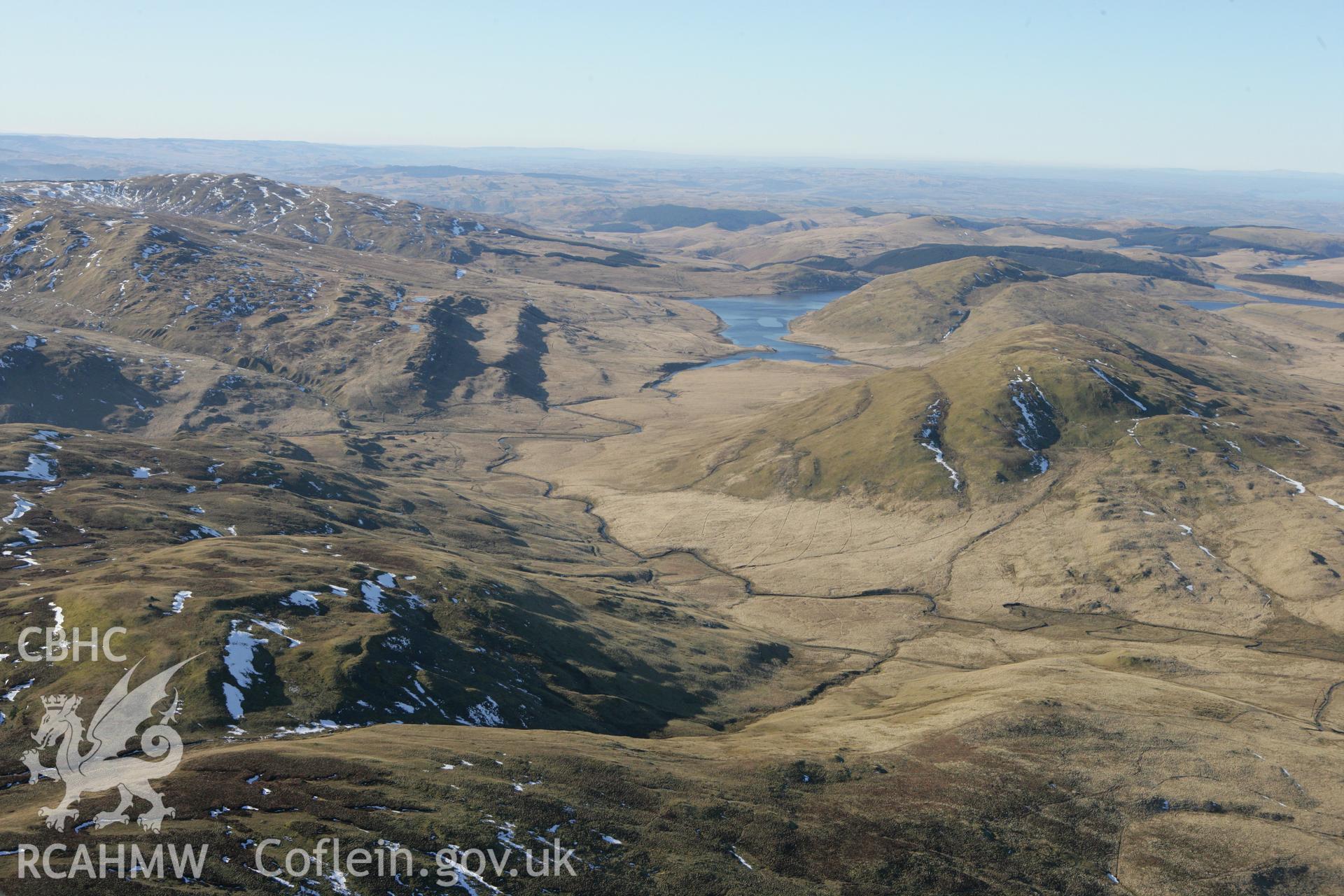 RCAHMW colour oblique photograph of Hyddgen lead mine, with Nant y moch reservoir, from the north. Taken by Toby Driver on 08/03/2010.