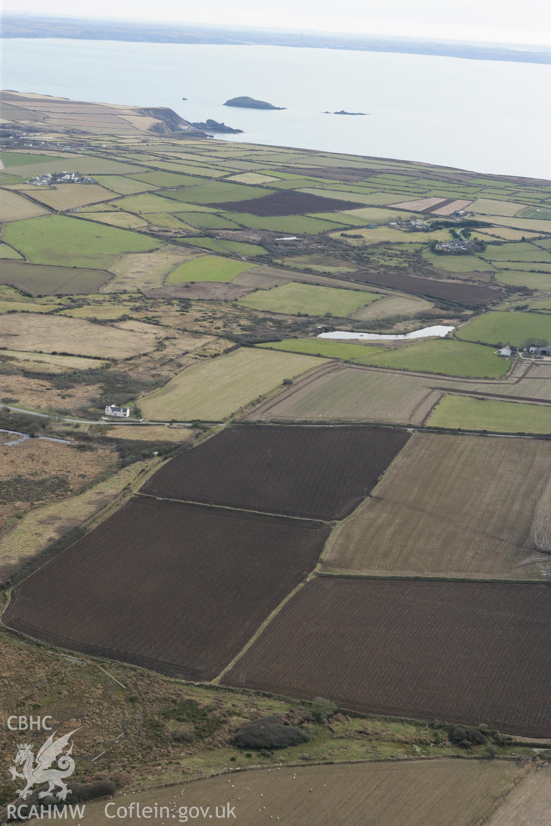 RCAHMW colour oblique aerial photograph of Ffos y Mynach, St Davids looking south. Taken on 02 March 2010 by Toby Driver