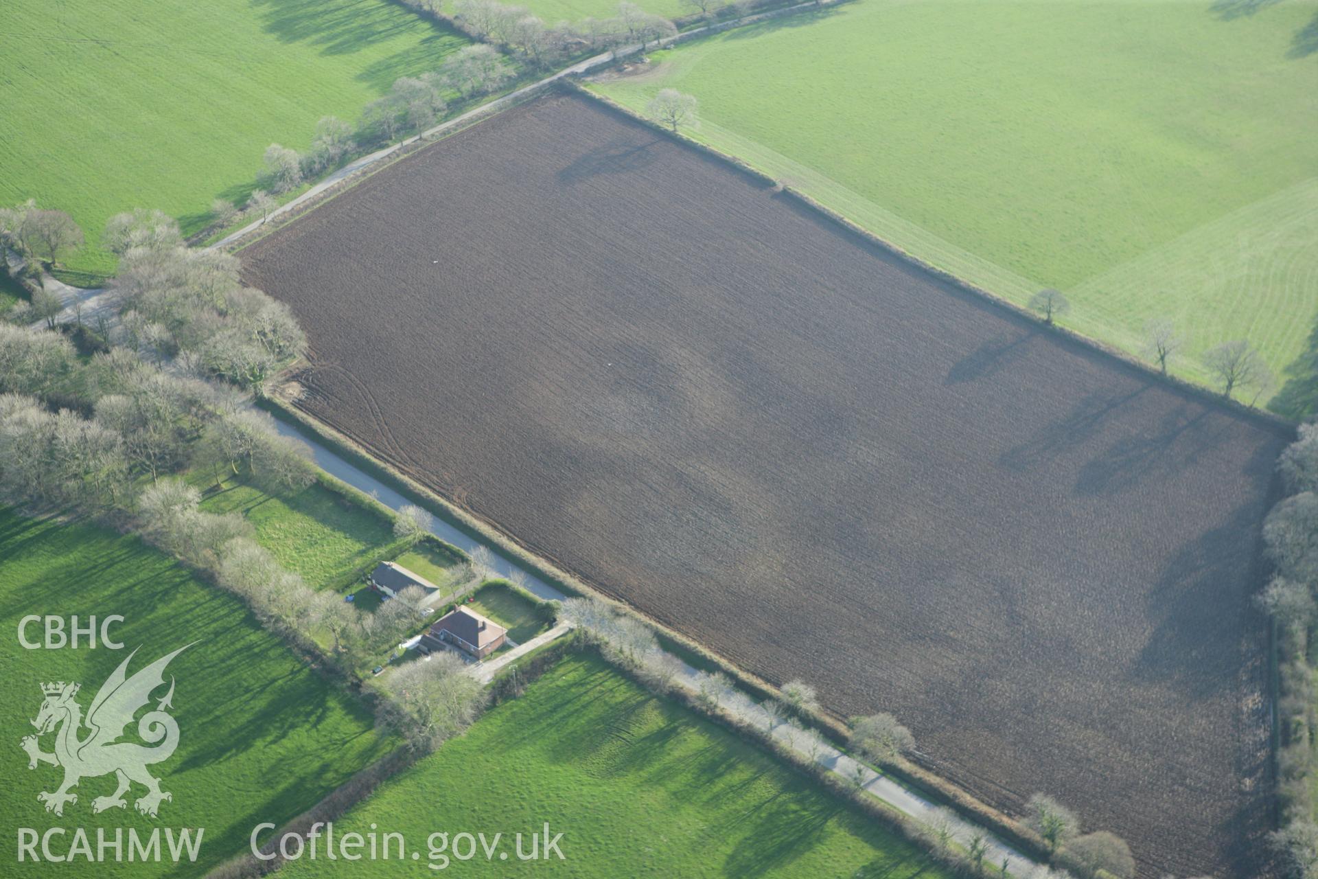 RCAHMW colour oblique aerial photograph of earthworks of Long Wood Quarries. Taken on 13 April 2010 by Toby Driver