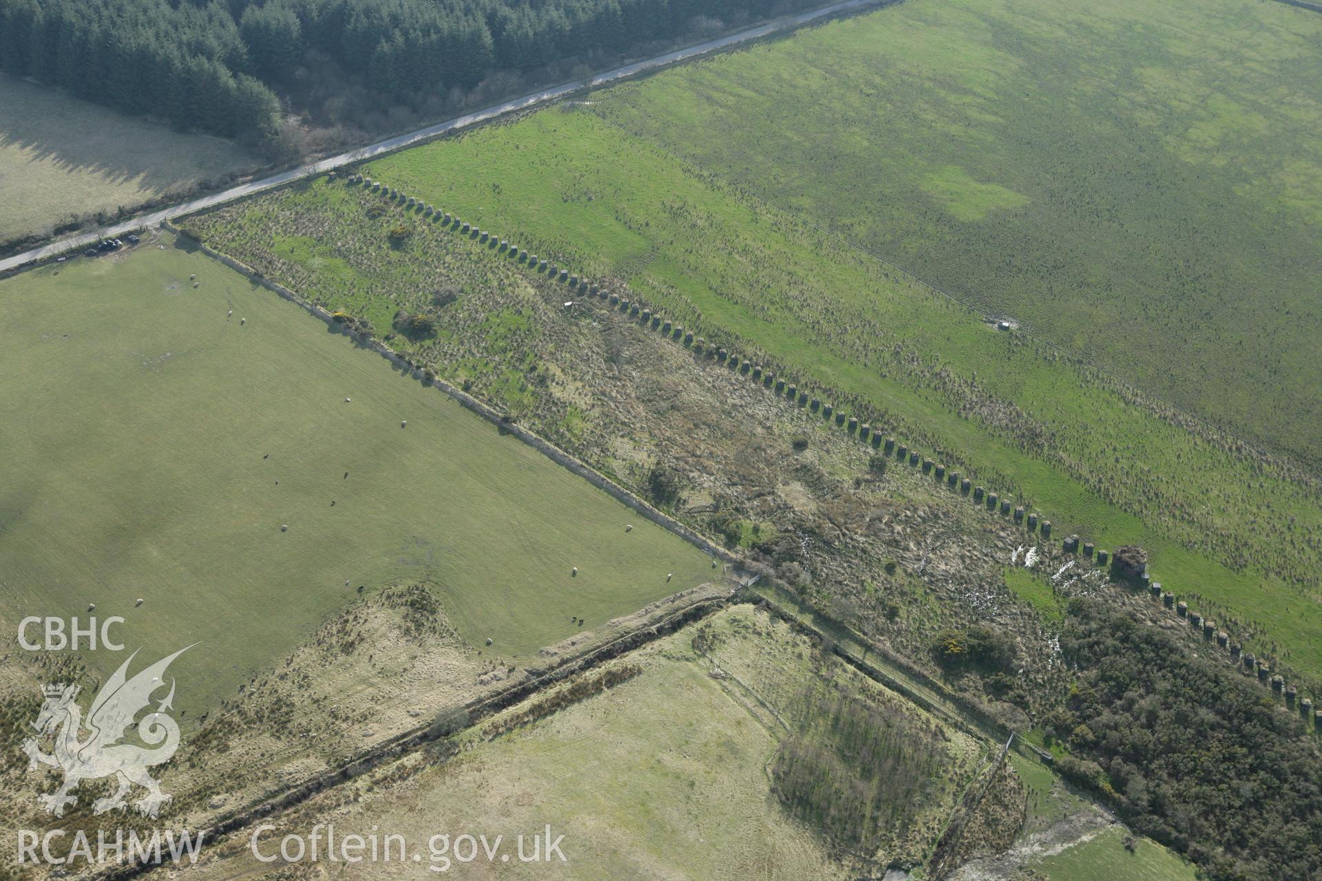 RCAHMW colour oblique aerial photograph of Rhos Llangeler Stop Line. Taken on 13 April 2010 by Toby Driver