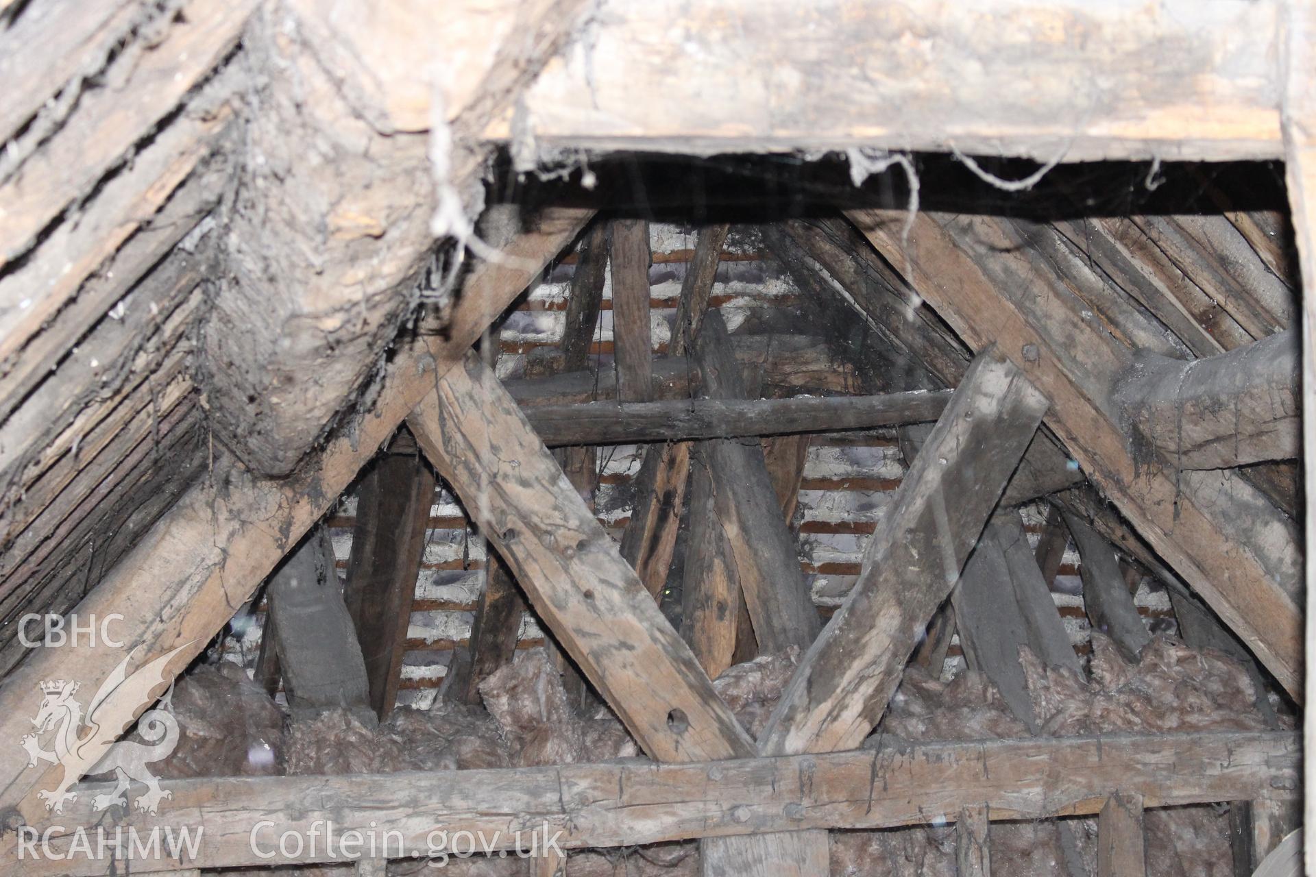 Colour photograph showing interior detail of timber roof frame at 5-7 Mwrog Street, Ruthin. Photographed during survey conducted by Geoff Ward on 14th May 2014.