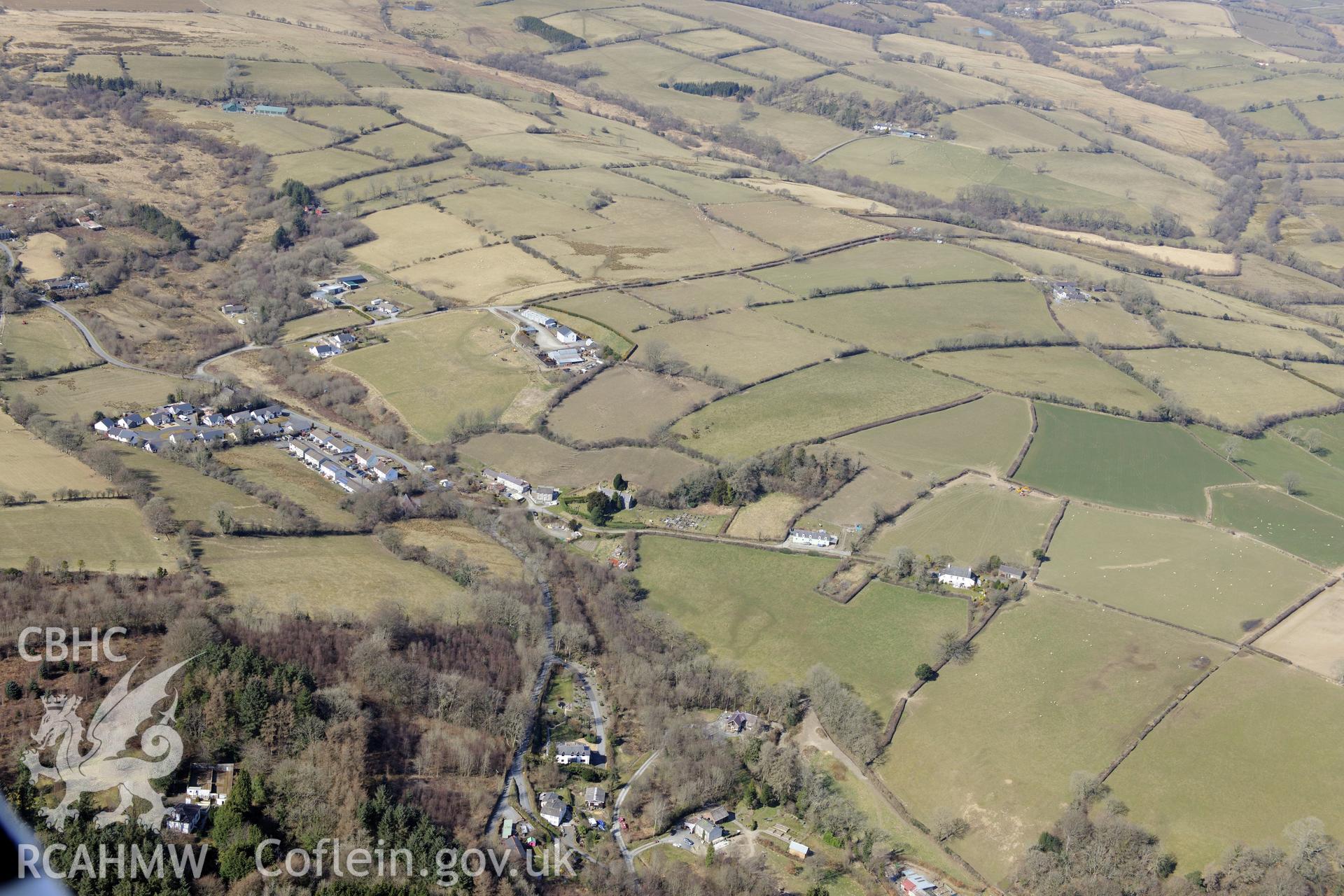 The village of Silian, north of Lampeter. Oblique aerial photograph taken during the Royal Commission?s programme of archaeological aerial reconnaissance by Toby Driver on 2nd April 2015.