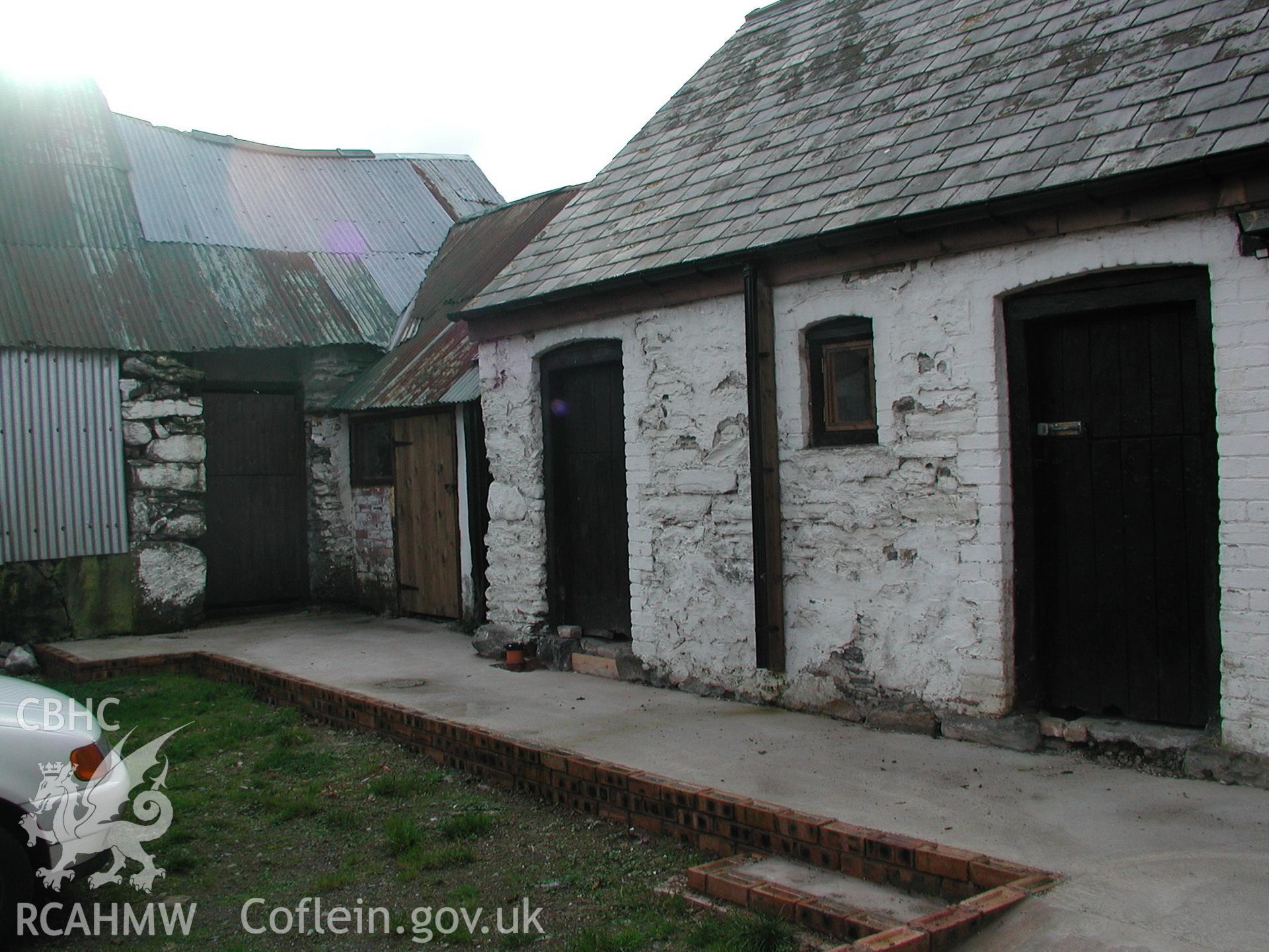 Exterior view of house with slate roof and shed or barn with corrugated iron roof. Photographic survey of Pistyll Gwyn Farmstead conducted by Geoff Ward on 13th November 2007.