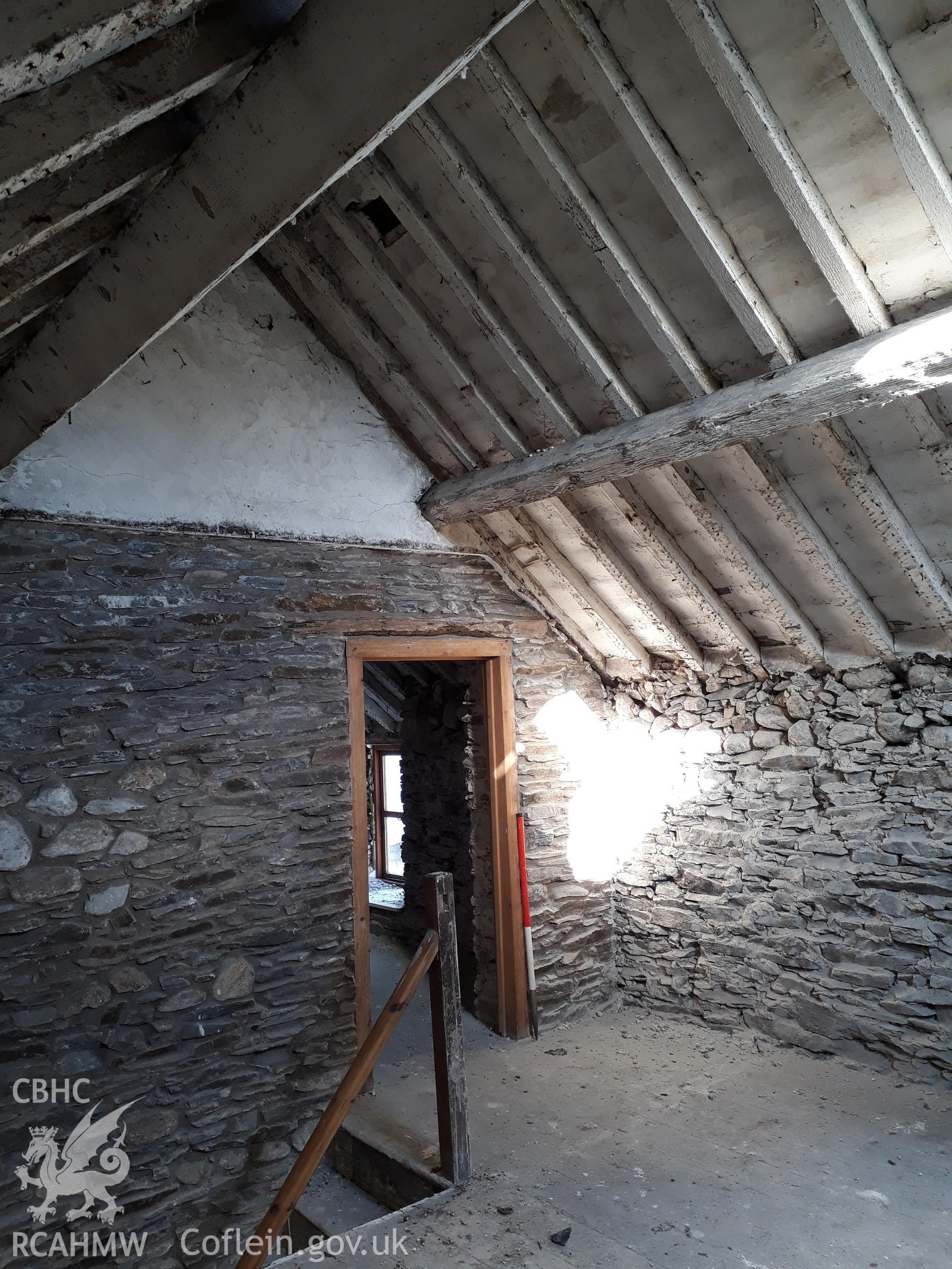 Bedroom 1, doorway to Bedroom 2. View north. 1m scale. Photographed as part of archaeological building recording conducted at Bryn Ysguboriau, Llanelidan, Denbighshire, carried out by Archaeology Wales, 2018. Project no. P2587.