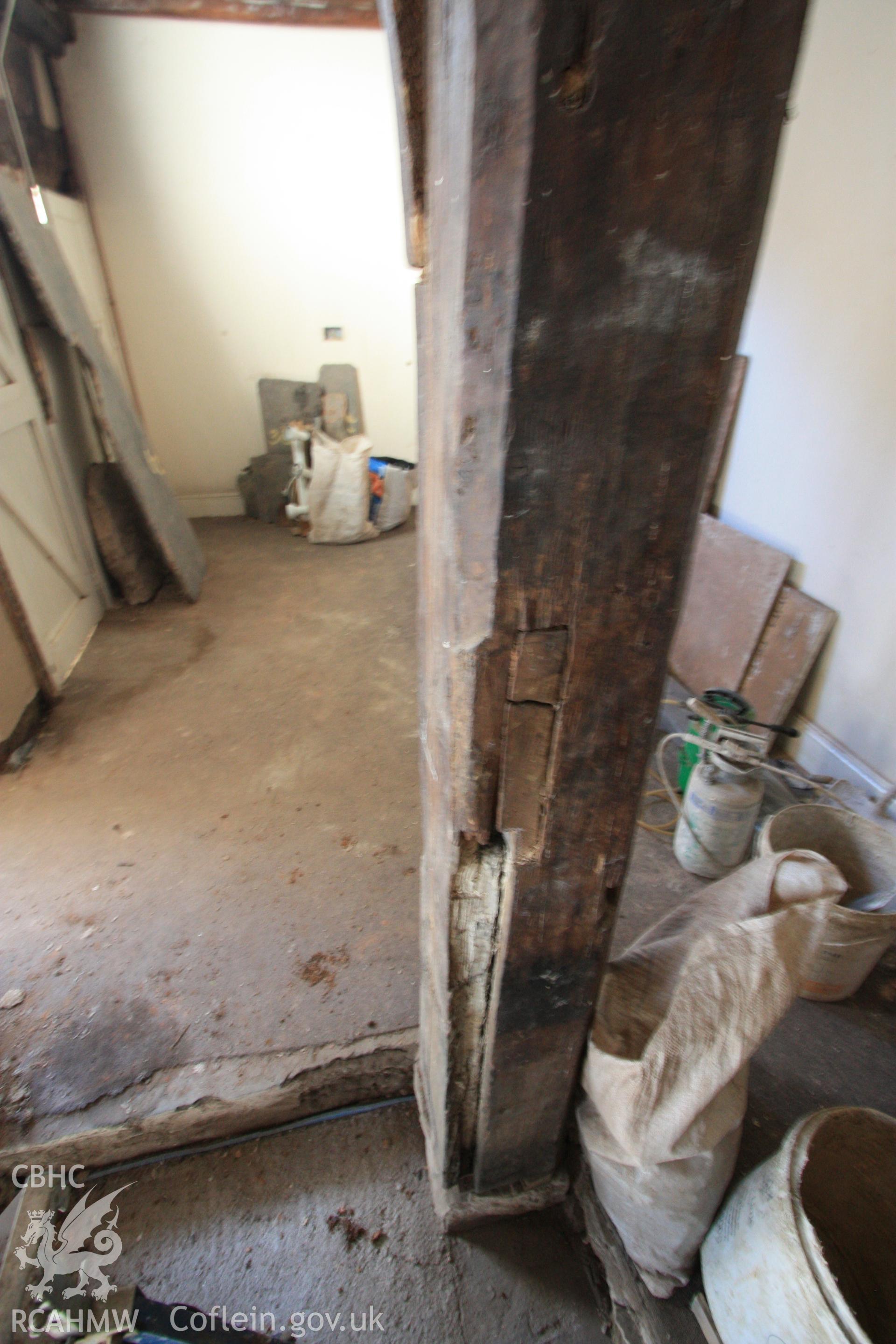 Colour photograph showing interior timber support post at Porth-y-Dwr, 67 Clwyd Street, Ruthin. Photographed during survey conducted by Geoff Ward on 10th June 2013.