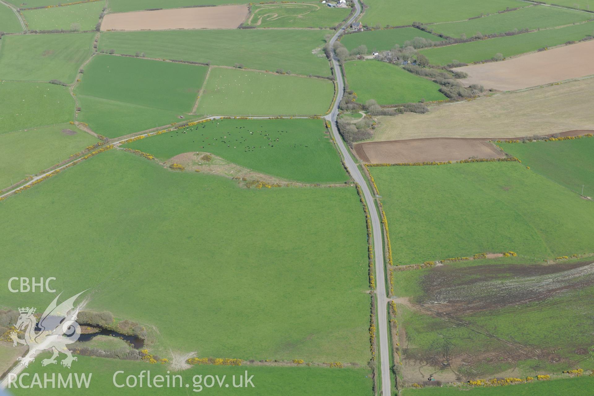 Crugiau Cemmaes Barrow I and II. Oblique aerial photograph taken during the Royal Commission's programme of archaeological aerial reconnaissance by Toby Driver on 15th April 2015.