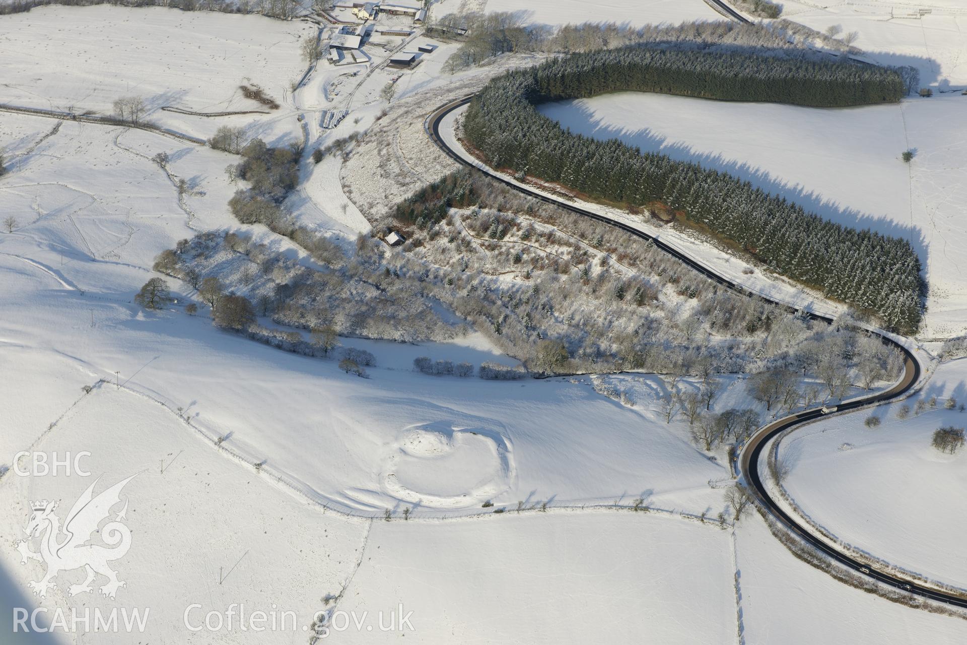 Castell Crugerydd motte and bailey, south east of Llandrindod Wells. Oblique aerial photograph taken during the Royal Commission?s programme of archaeological aerial reconnaissance by Toby Driver on 15th January 2013.