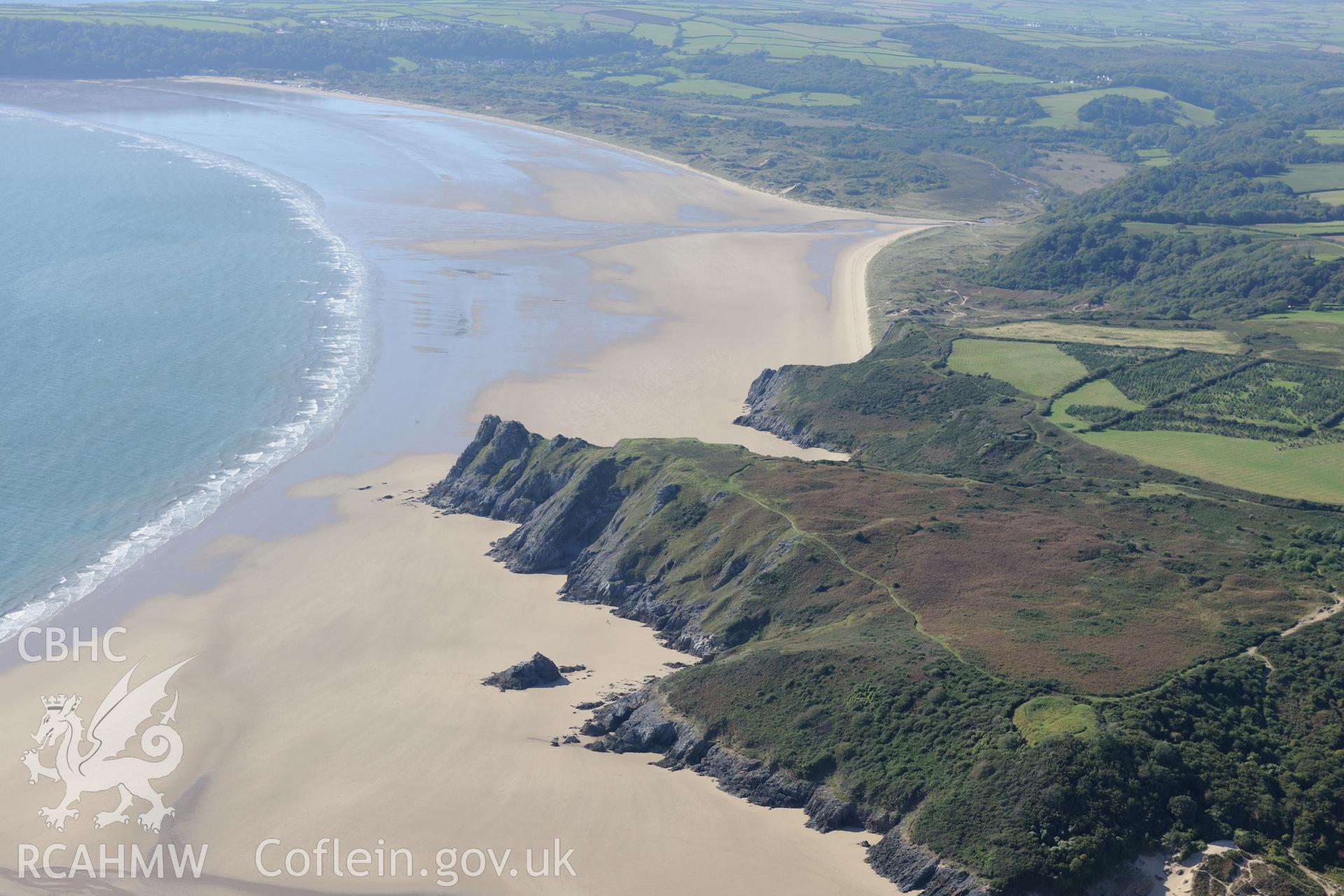 Castle Tower and Three Cliffs Bay landing point, on the southern coast of the Gower Peninsula. Oblique aerial photograph taken during the Royal Commission's programme of archaeological aerial reconnaissance by Toby Driver on 30th September 2015.