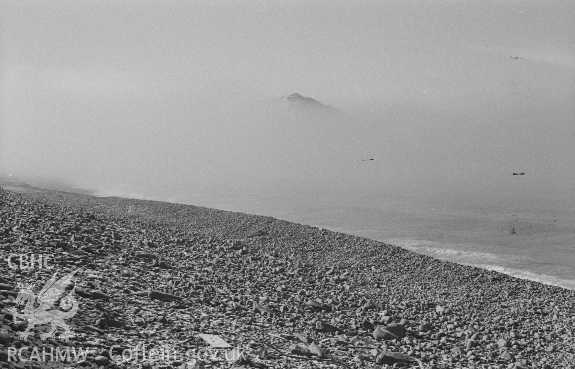 Digital copy of a black and white negative showing Allt-Wen and Tan-y-Bwlch beach from the store pier; snow and sea mist. Photographed by Arthur O. Chater in April 1968. (Looking south south west from Grid Reference SN 579 807).