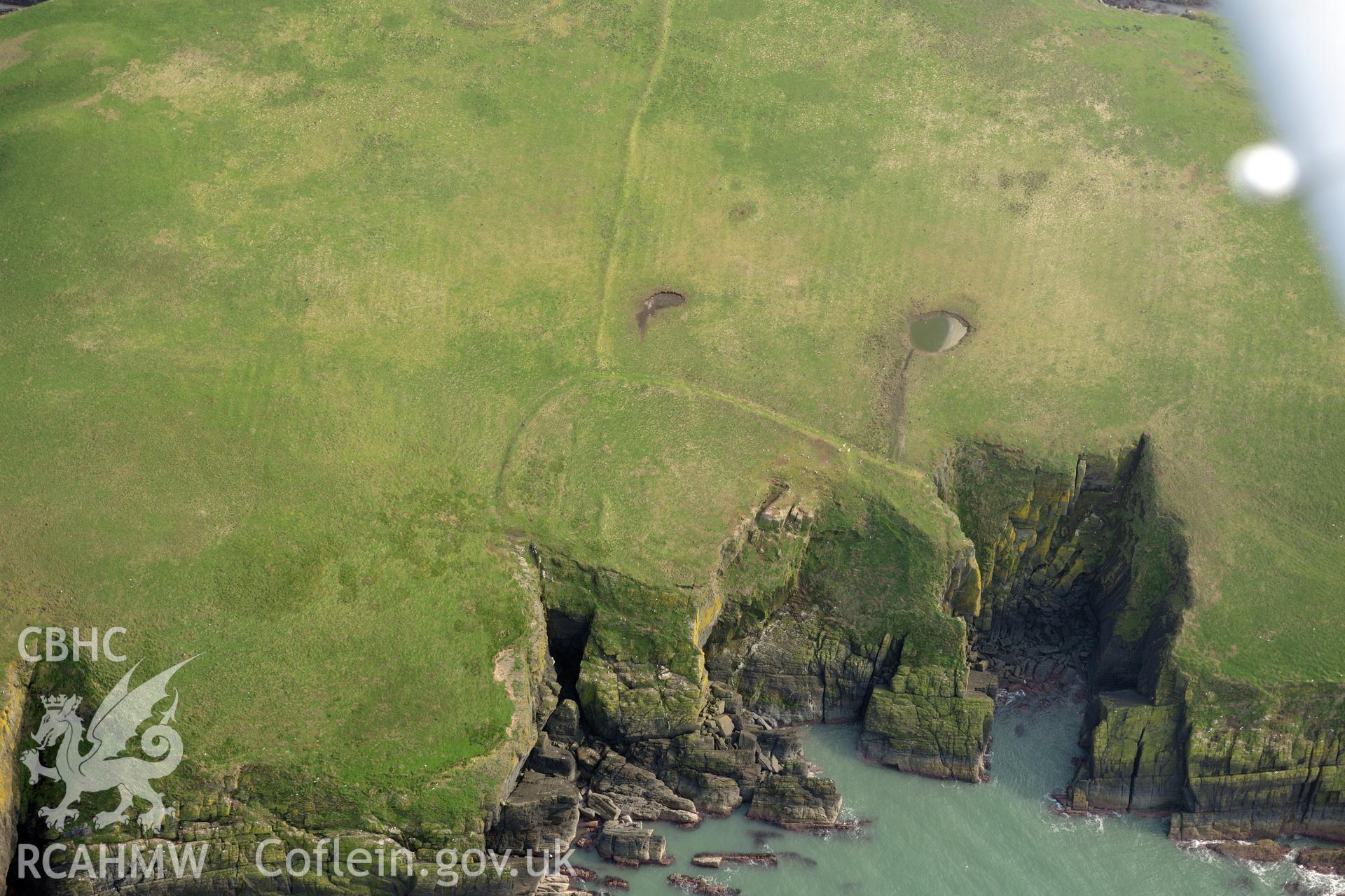 Aerial photography of Cardigan Island promontory enclosure taken on 27th March 2017. Baseline aerial reconnaissance survey for the CHERISH Project. ? Crown: CHERISH PROJECT 2017. Produced with EU funds through the Ireland Wales Co-operation Programme 2014-2020. All material made freely available through the Open Government Licence.