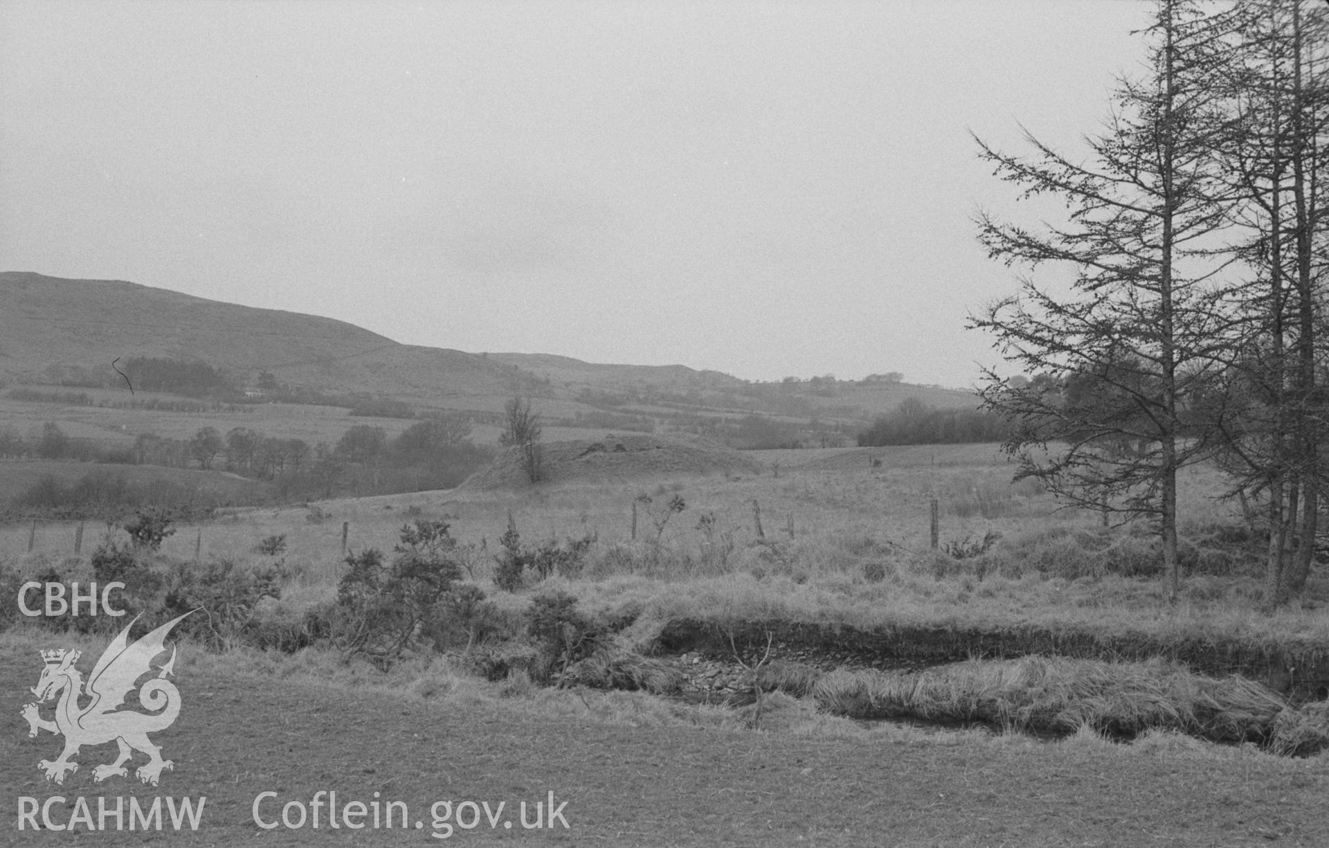 Digital copy of a black and white negative showing view over the Afon Meurig to Castell Meurig 250m south south west of Cwm-Meurig-Isaf. Photographed in April 1964 by Arthur O. Chater from Grid Reference SN 7185 6765, looking north.