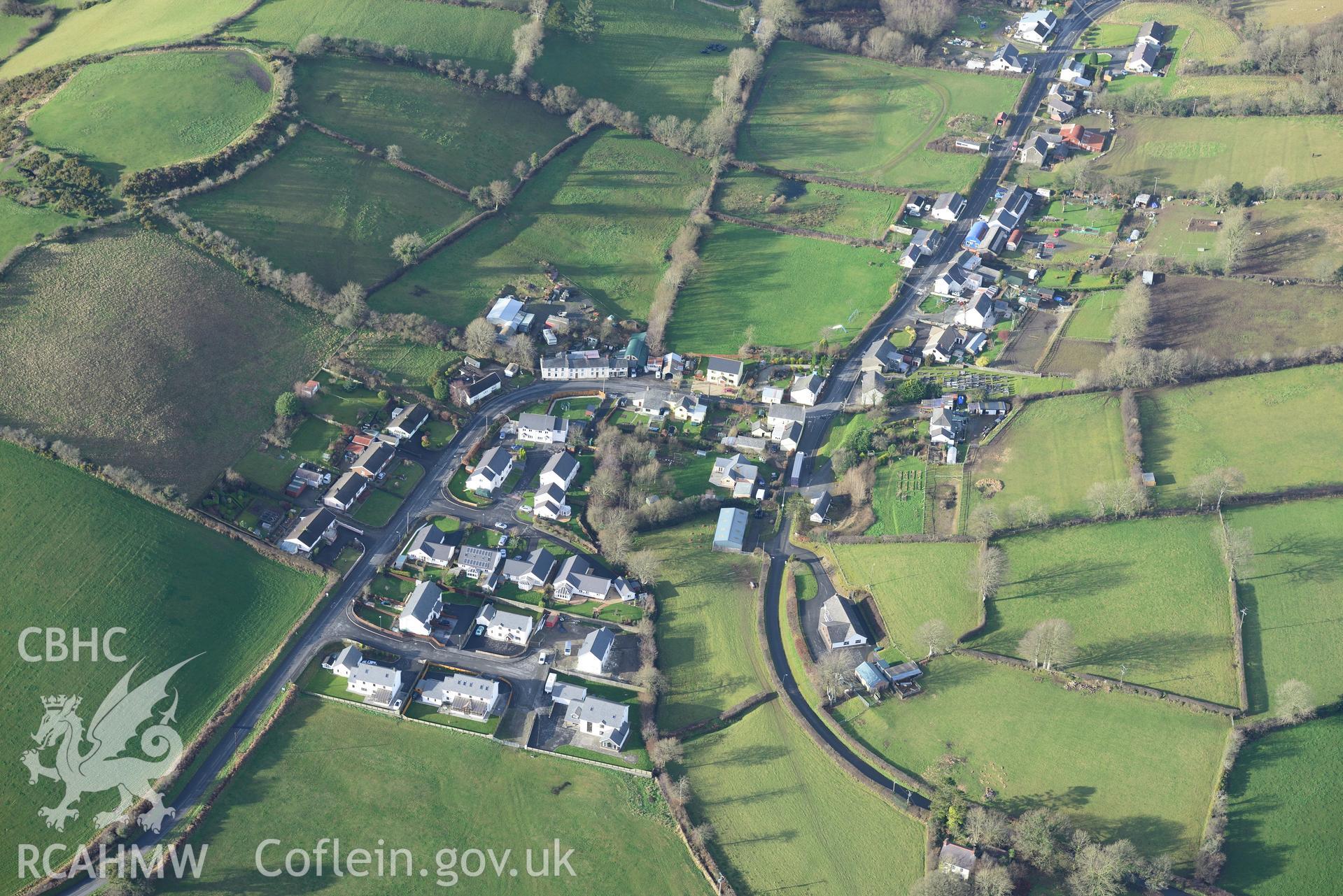 Cribyn village, Welsh Unitarian Chapel and Gaer Maesmynach hill fort. Oblique aerial photograph taken during the Royal Commission's programme of archaeological aerial reconnaissance by Toby Driver on 6th January 2015.