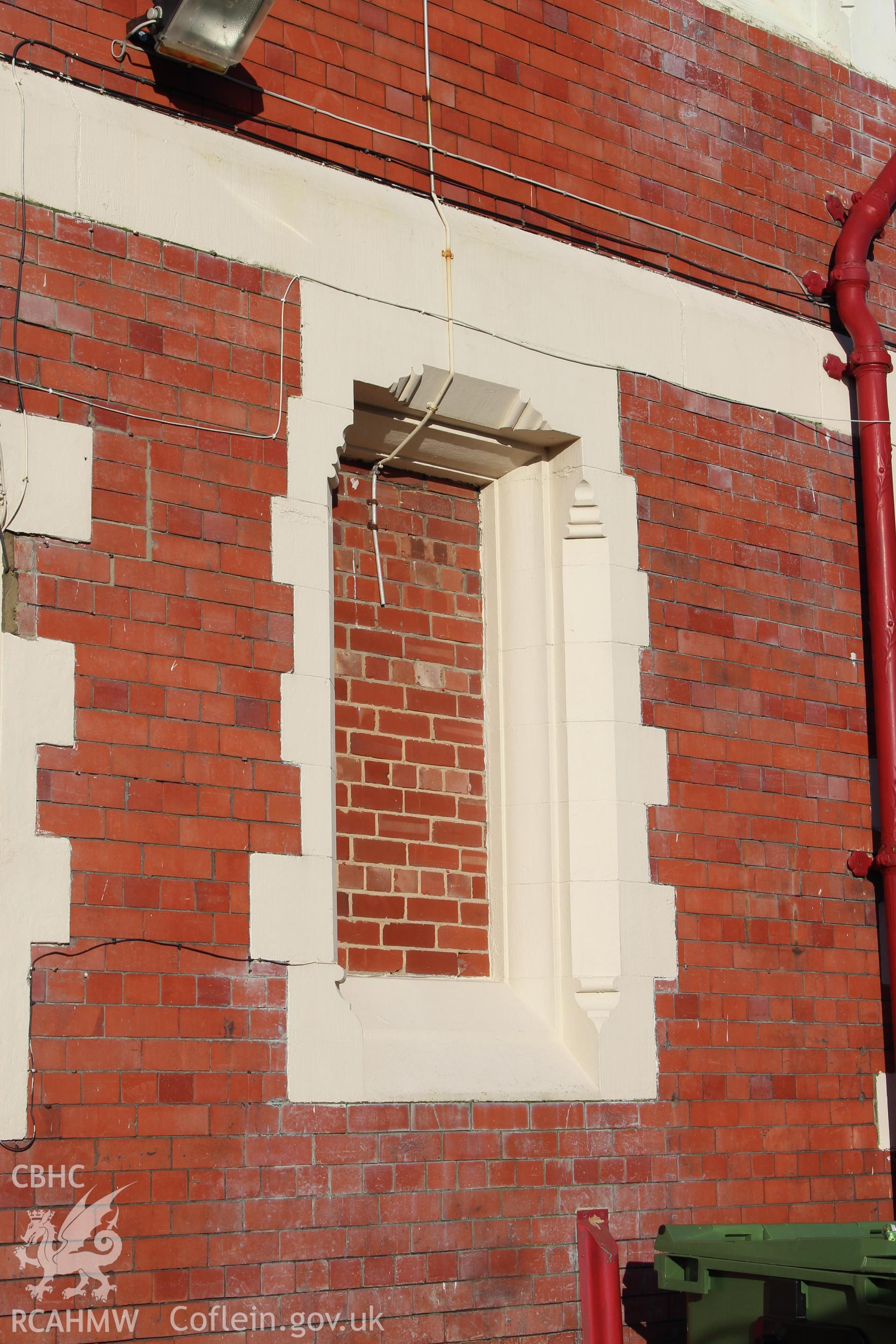 Detailed view of bricked-up window on side elevation wall at the Railway Institute, Bangor. Photographed during survey conducted by Sue Fielding for the RCAHMW on 4th April 2016.