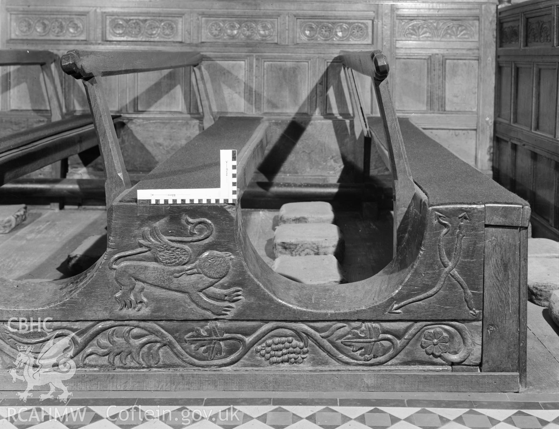 Digital copy of a black and white negative showing carved wooden pews at Rhug Chapel, taken by Department of Environment.