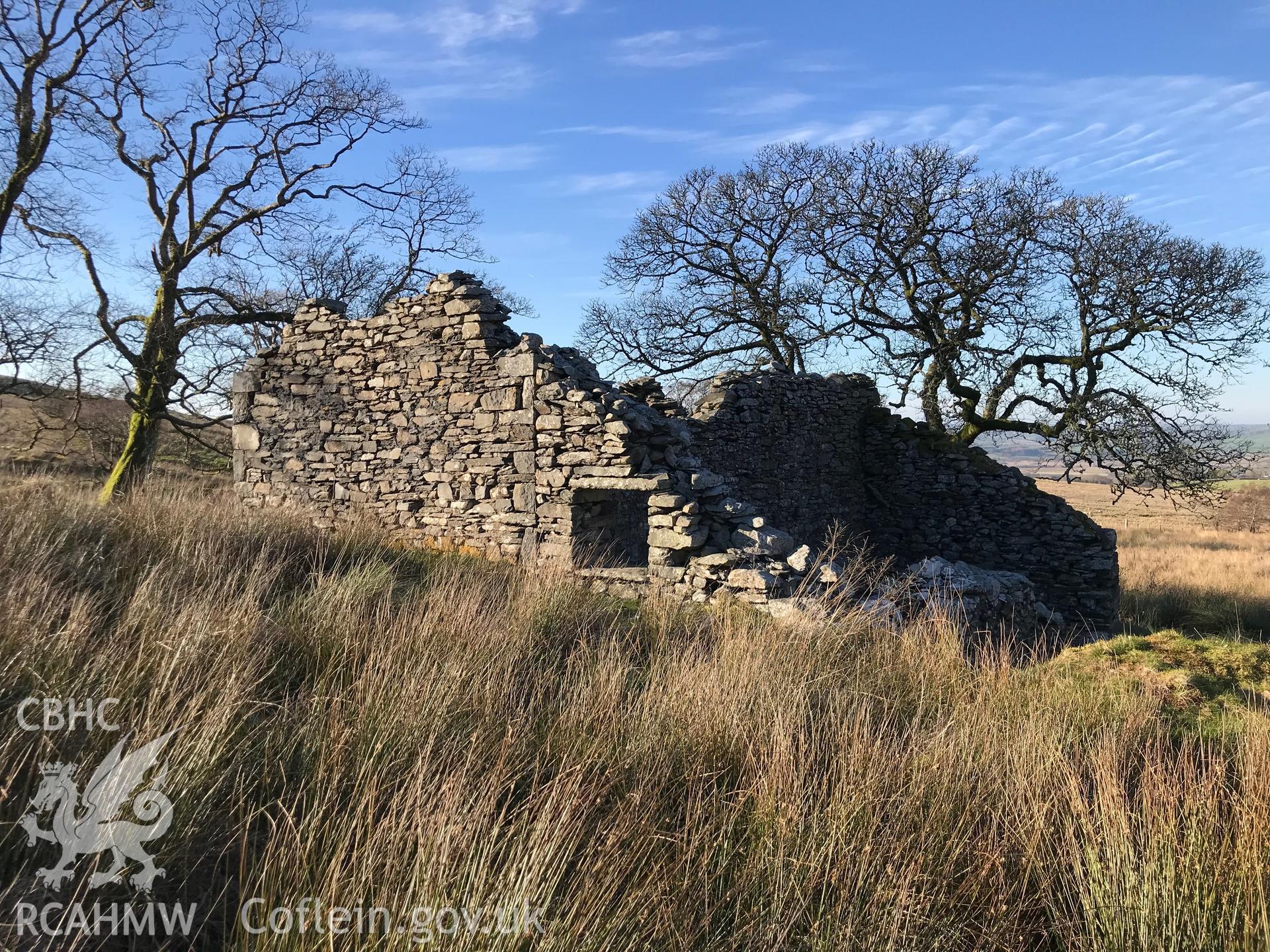 Exterior view of the ruined Caradog house, south west of Bryneithinog farm, Ystrad Fflur. Colour photograph taken by Paul R. Davis on 18th November 2018.