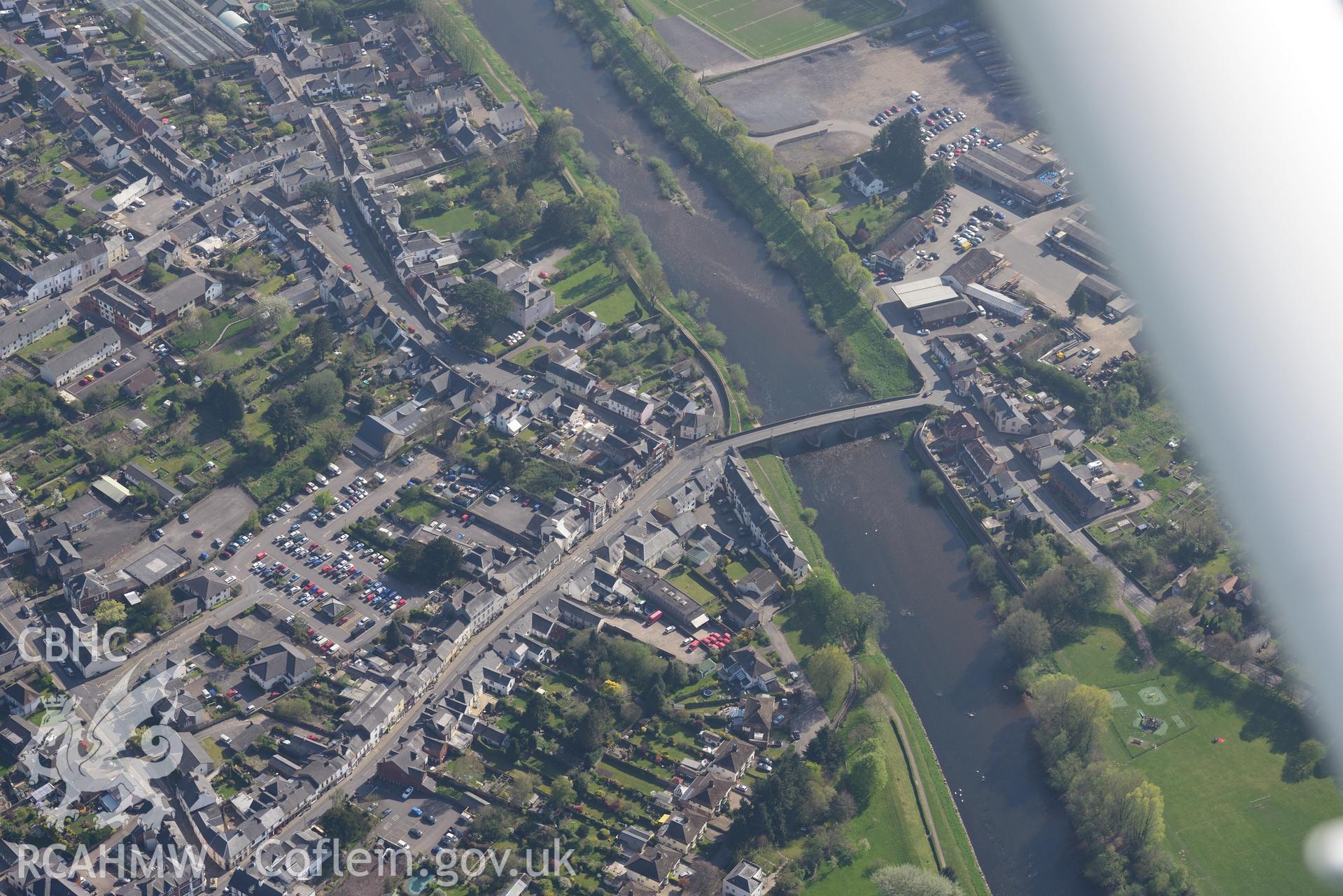 Usk Town including Usk road bridge, Toll House and The Lawns. Oblique aerial photograph taken during the Royal Commission's programme of archaeological aerial reconnaissance by Toby Driver on 21st April 2015
