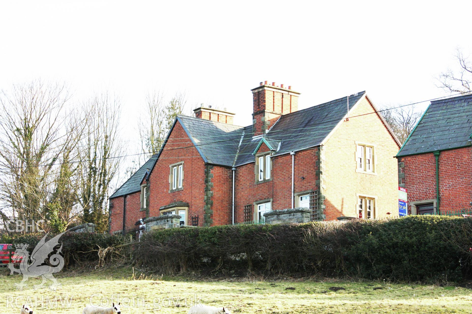 Colour photograph showing red brick exterior of Pentre Cottages, Leighton. Photographed during survey conducted by Geoff Ward on 11th July 2009.