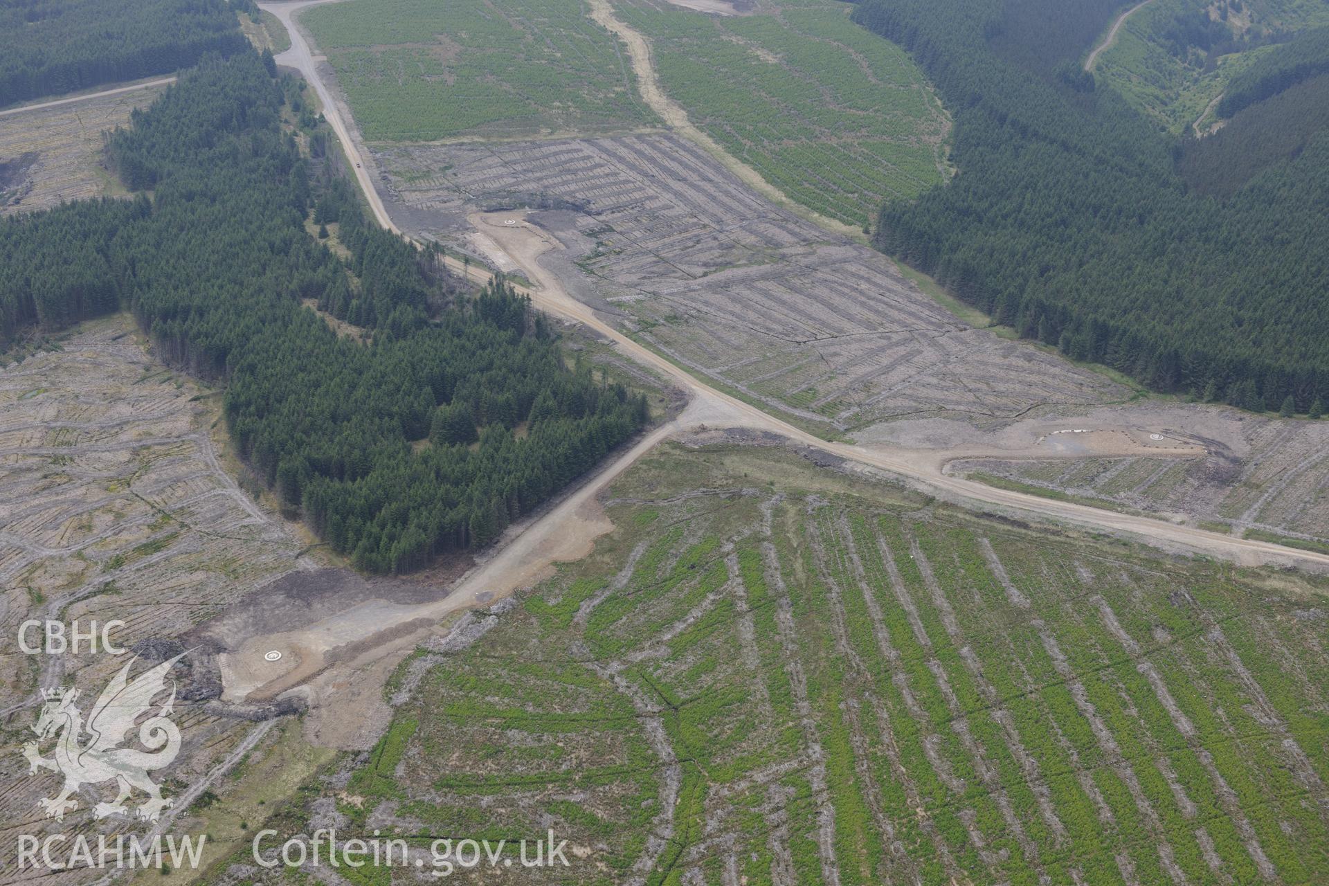 Pen y Cymoedd wind farm under construction before officially opening in September 2017.  Oblique aerial photograph taken during the Royal Commission's programme of archaeological aerial reconnaissance by Toby Driver on 11th June 2015.