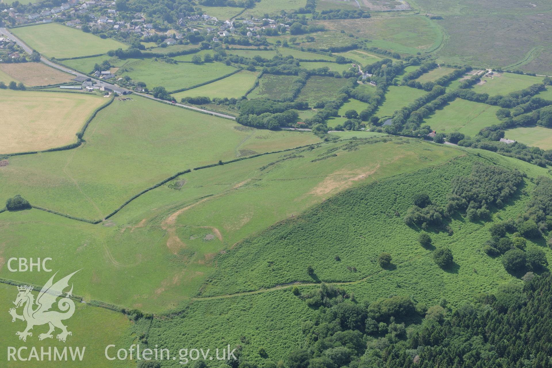 Cil Ifor Top Promontory Fort near Llanrhidian, on the Gower. Oblique aerial photograph taken during the Royal Commission?s programme of archaeological aerial reconnaissance by Toby Driver on 16th July 2013.