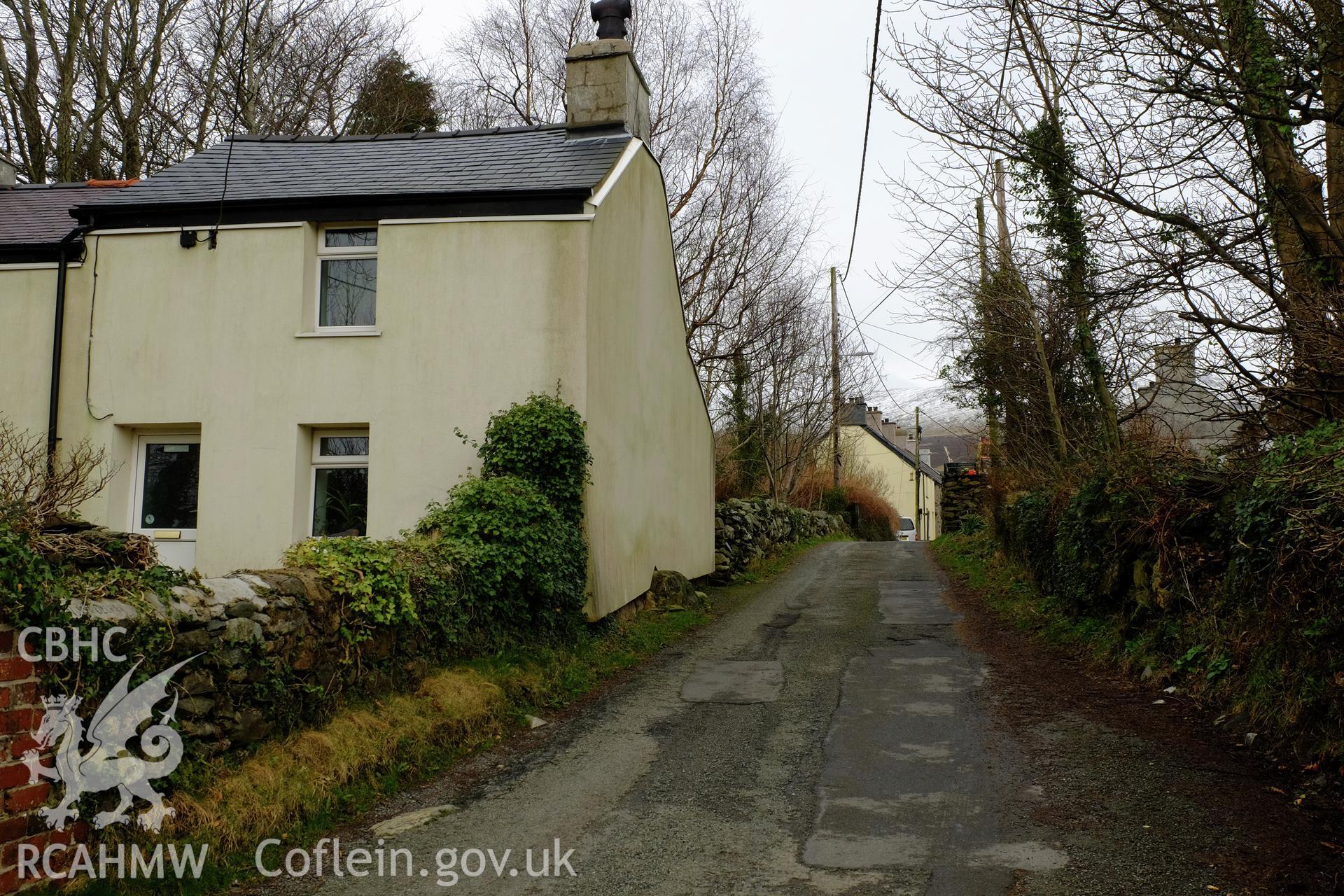 Colour photograph showing view looking east at housing in Min Afon, at the west end of Clwt-y-bont, Deiniolen, produced by Richard Hayman 2nd March 2017