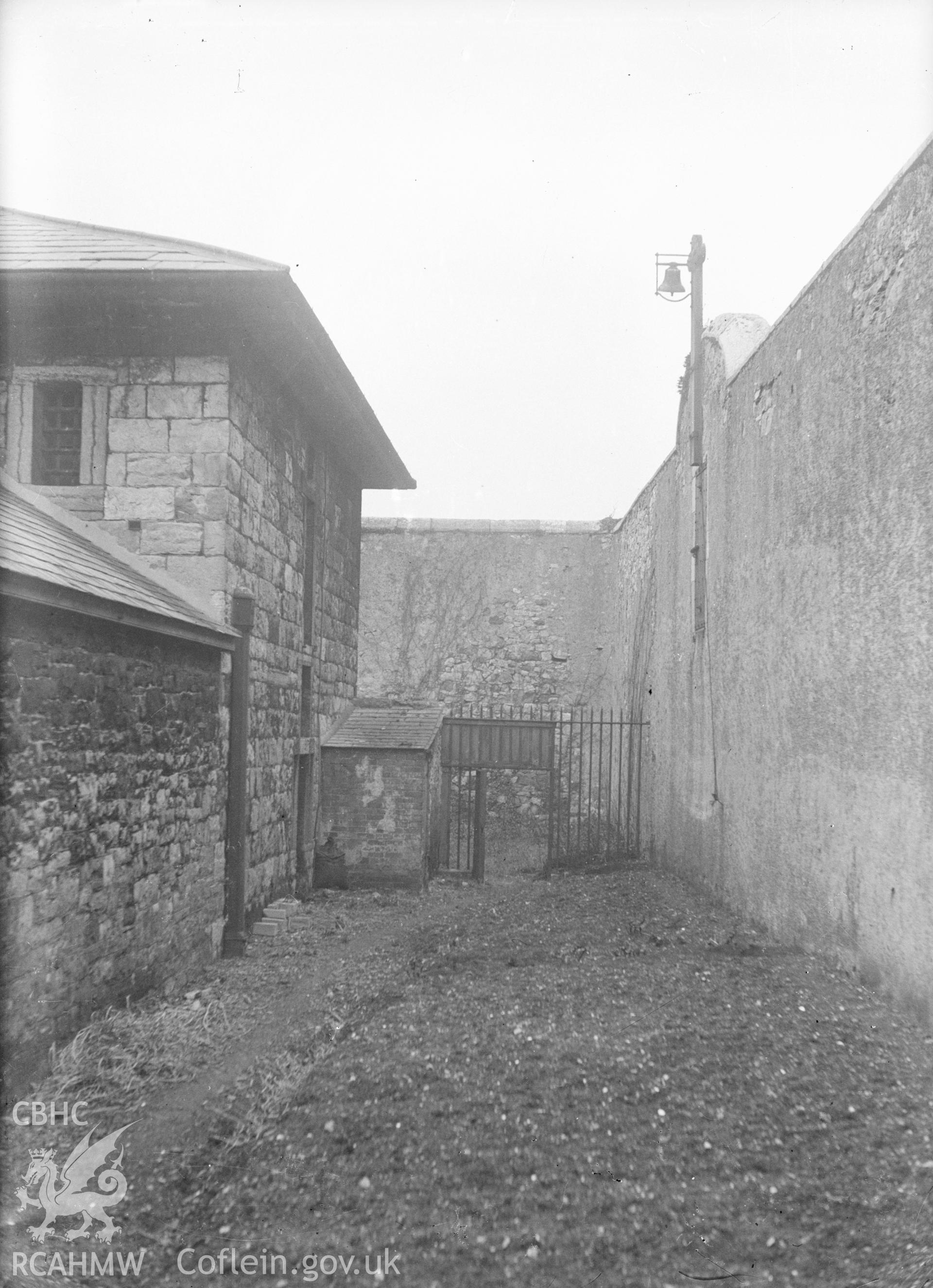 Digital copy of a nitrate negative showing exterior wall of Beaumaris Gaol. From the Cadw Monuments in Care Collection.