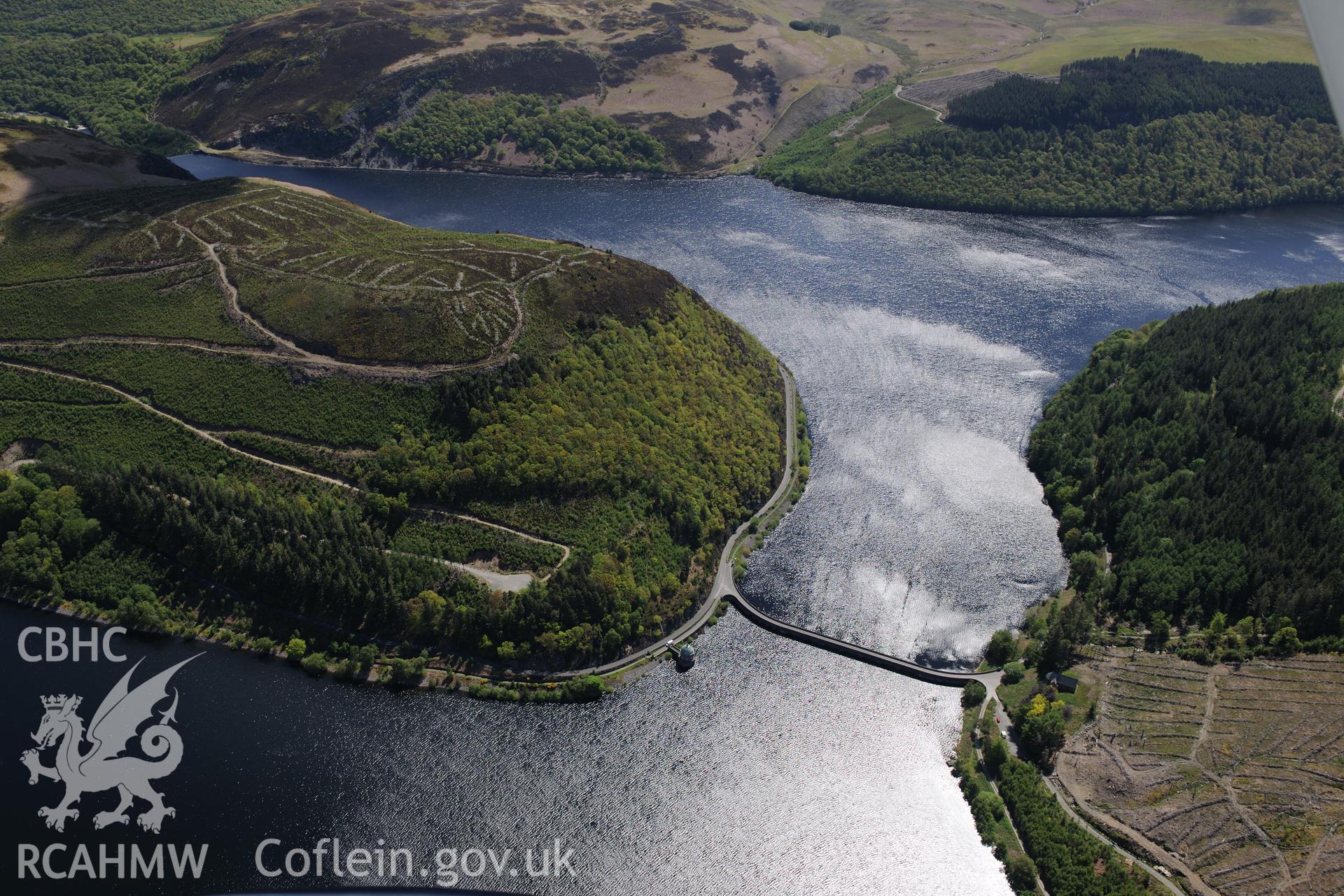 Nantgwyllt church and Garreg-Ddu dam, valve tower and reservoir at the Elan Valley water scheme. Oblique aerial photograph taken during the Royal Commission's programme of archaeological aerial reconnaissance by Toby Driver on 3rd June 2015.