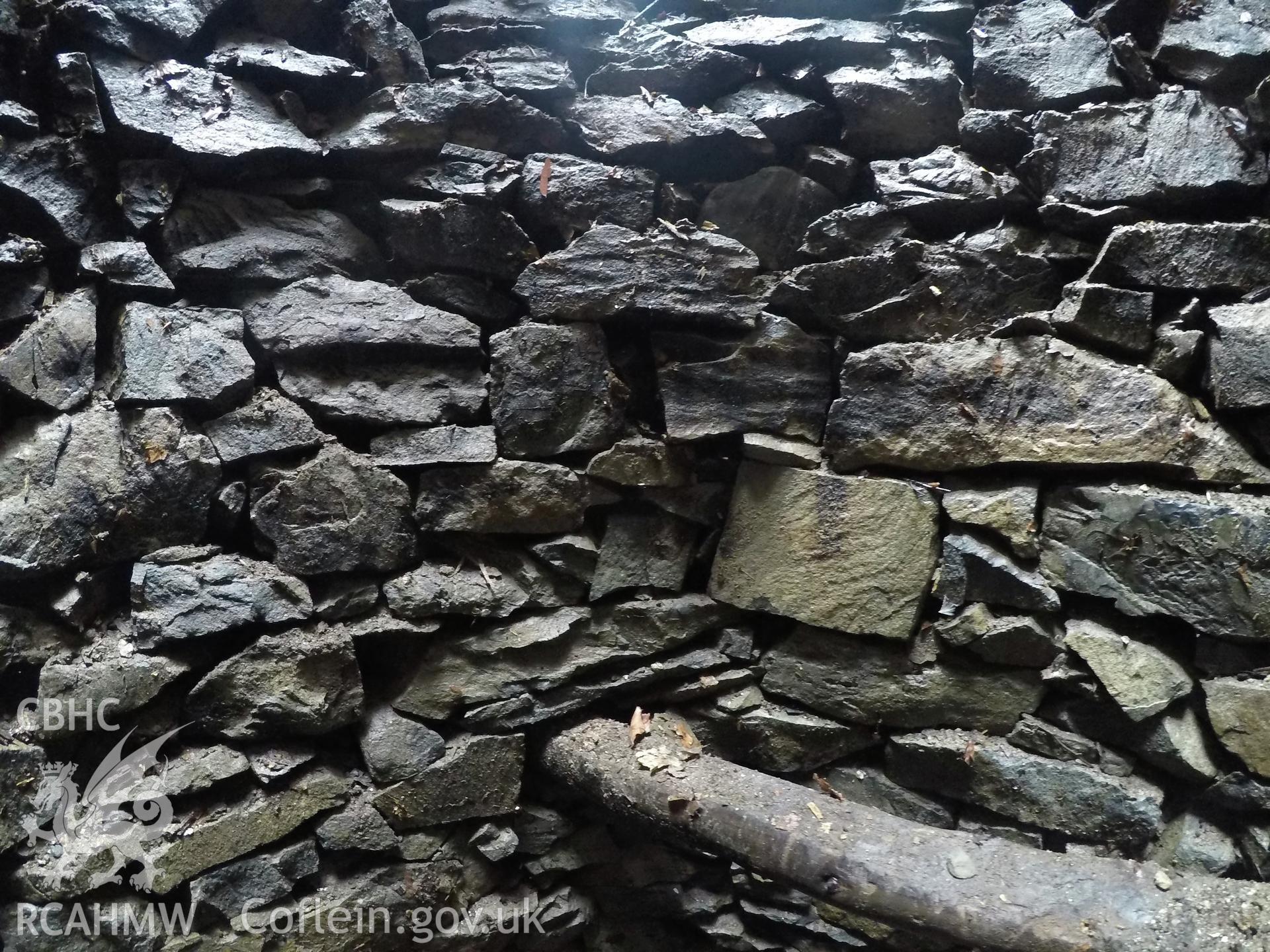 View from the east of well interior at 3.0m depth. Photographed by Gwynedd Archaeological Trust as part of archaeological mitigation report for well at Plas Celynin, Henryd, Conwy, on 1st August 2018. Project no. G2568.