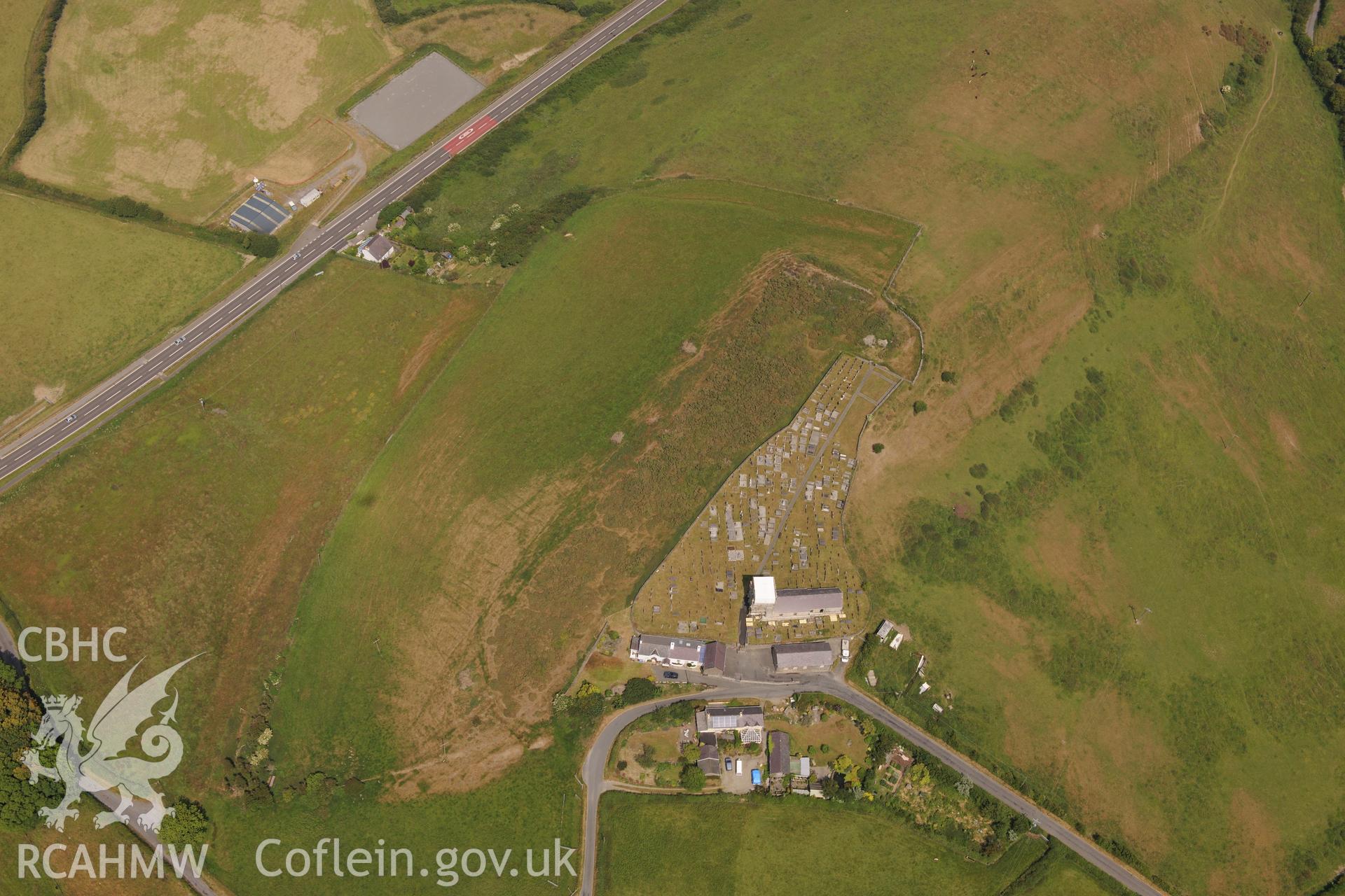Hillfort, St David's Church, and Sunday School at Llanddewi Aberarth, south west of Aberystwyth. Oblique aerial photograph taken during the Royal Commission?s programme of archaeological aerial reconnaissance by Toby Driver on  12th July 2013.