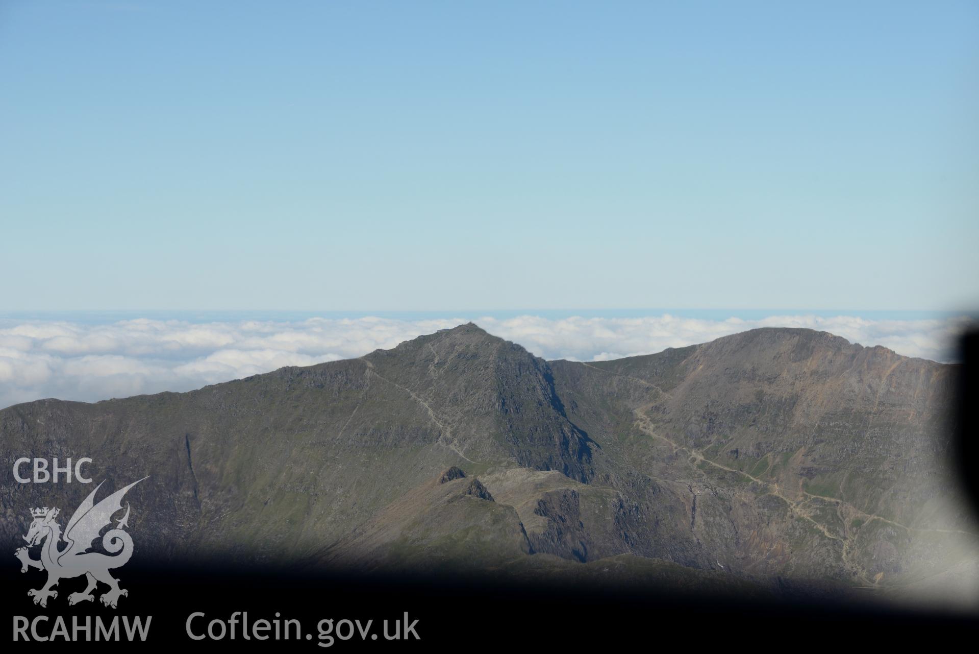 Snowdon Summit and the railway terminus, Snowdonia. Oblique aerial photograph taken during the Royal Commission's programme of archaeological aerial reconnaissance by Toby Driver on 2nd October 2015.