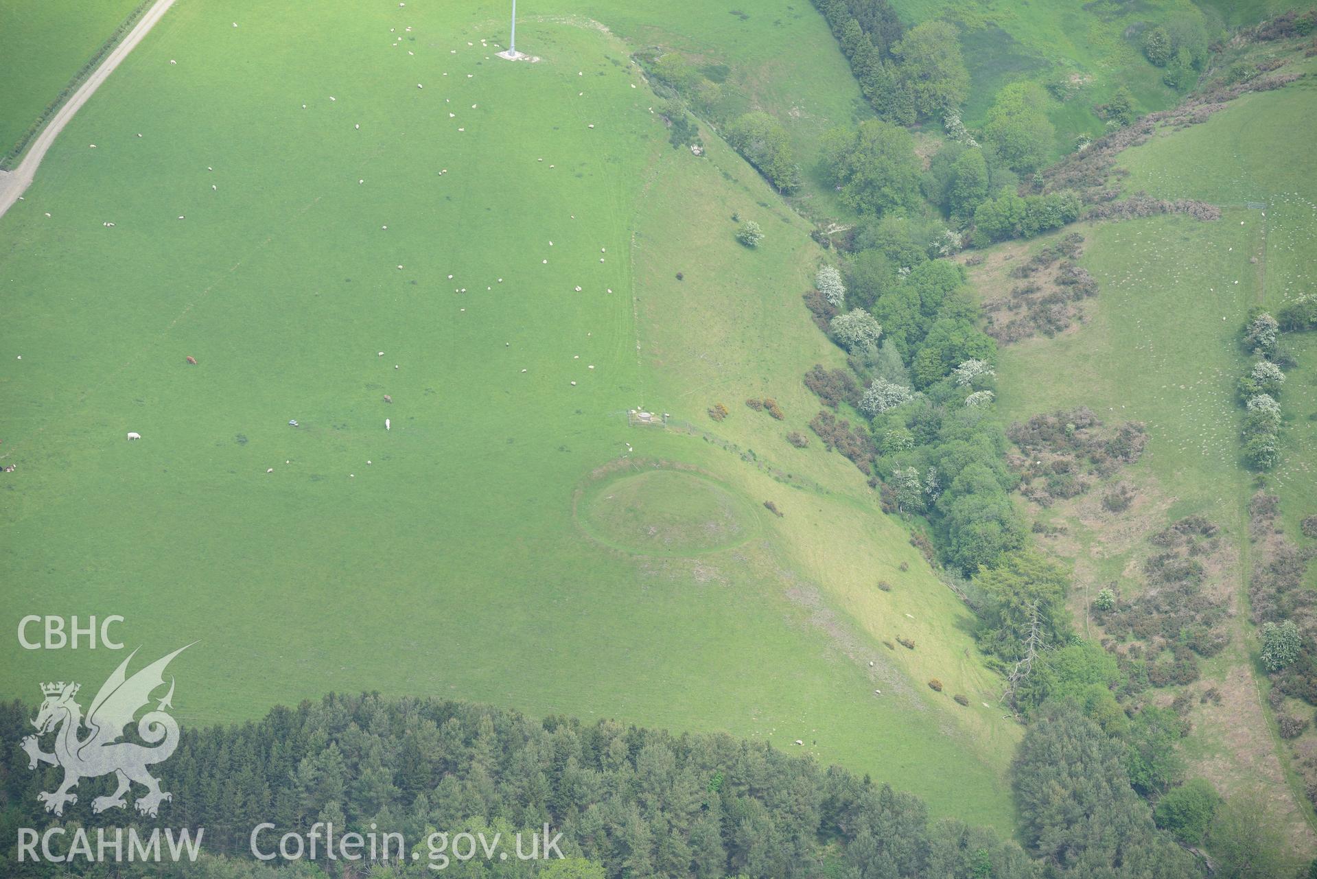 Tomen Castle, New Radnor. Oblique aerial photograph taken during the Royal Commission's programme of archaeological aerial reconnaissance by Toby Driver on 11th June 2015.