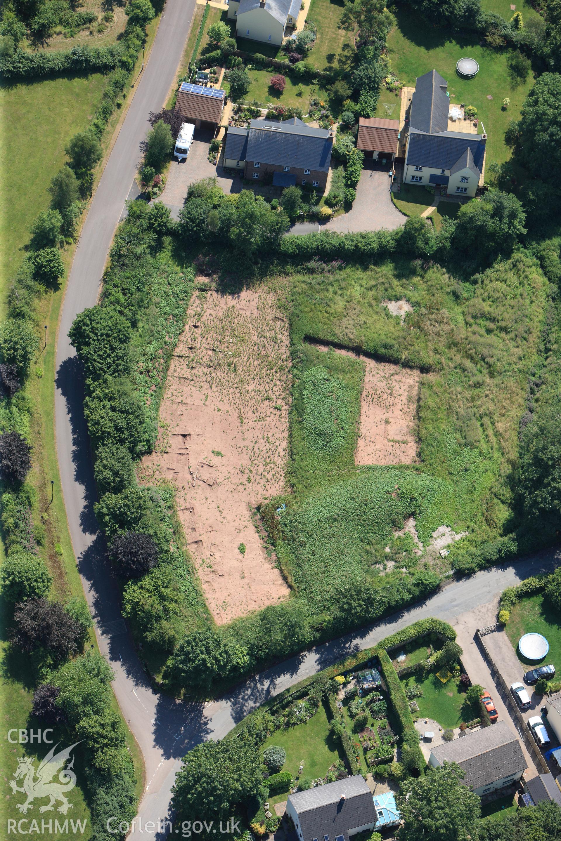 Land opposite the church at Trellech village, south of Monmouth. Oblique aerial photograph taken during the Royal Commission?s programme of archaeological aerial reconnaissance by Toby Driver on 1st August 2013.