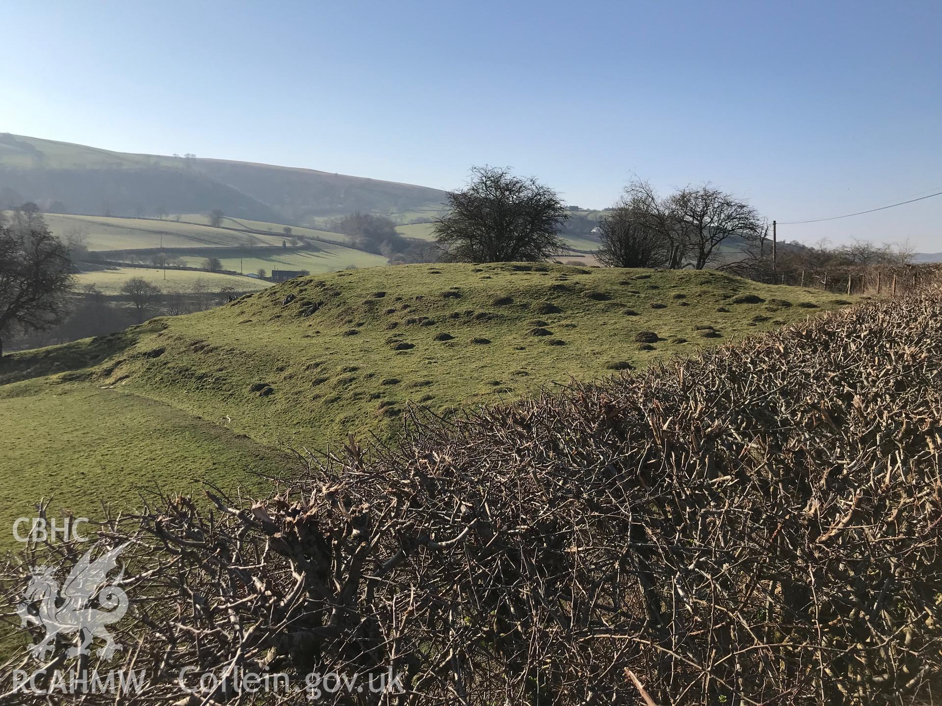 Digital colour photograph of square enclosure and mound at Vron, Glascwm, north east of Builth Wells, taken by Paul R. Davis on 26th February 2019.