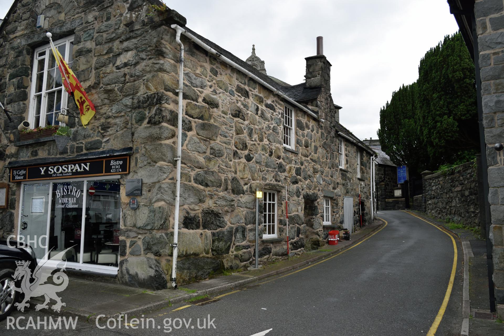 Colour photograph showing view looking south west at the south elevation of Y Sospan, Llys Owain, Dolgellau. Photographed by I. P. Brookes of Engineering Archaeological Services, June 2019.