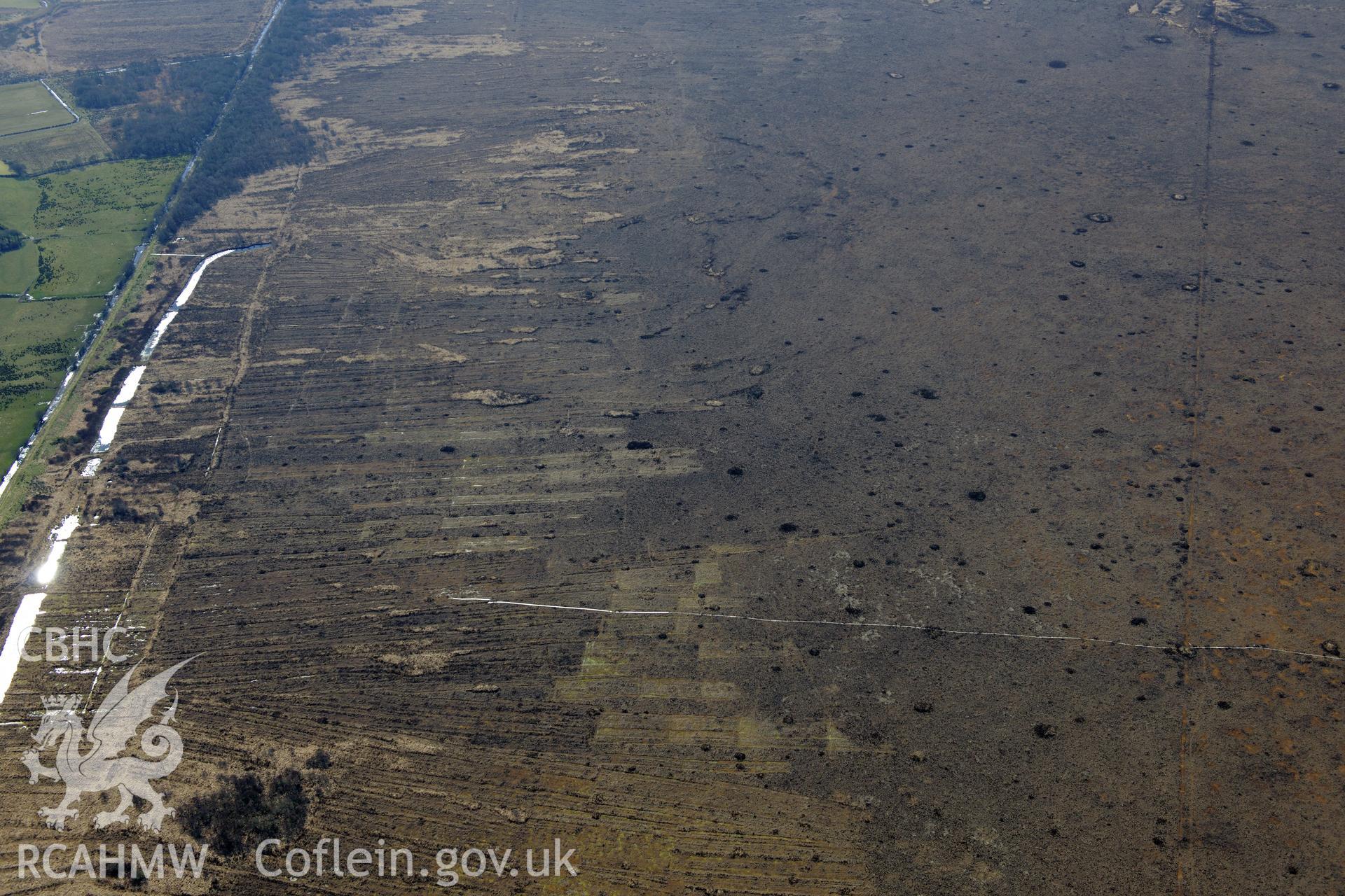 Cors Fochno, Borth Bog, peat cutting and drains, north east of Borth, Aberystwyth. Oblique aerial photograph taken during the Royal Commission's programme of archaeological aerial reconnaissance by Toby Driver on 2nd April 2013.