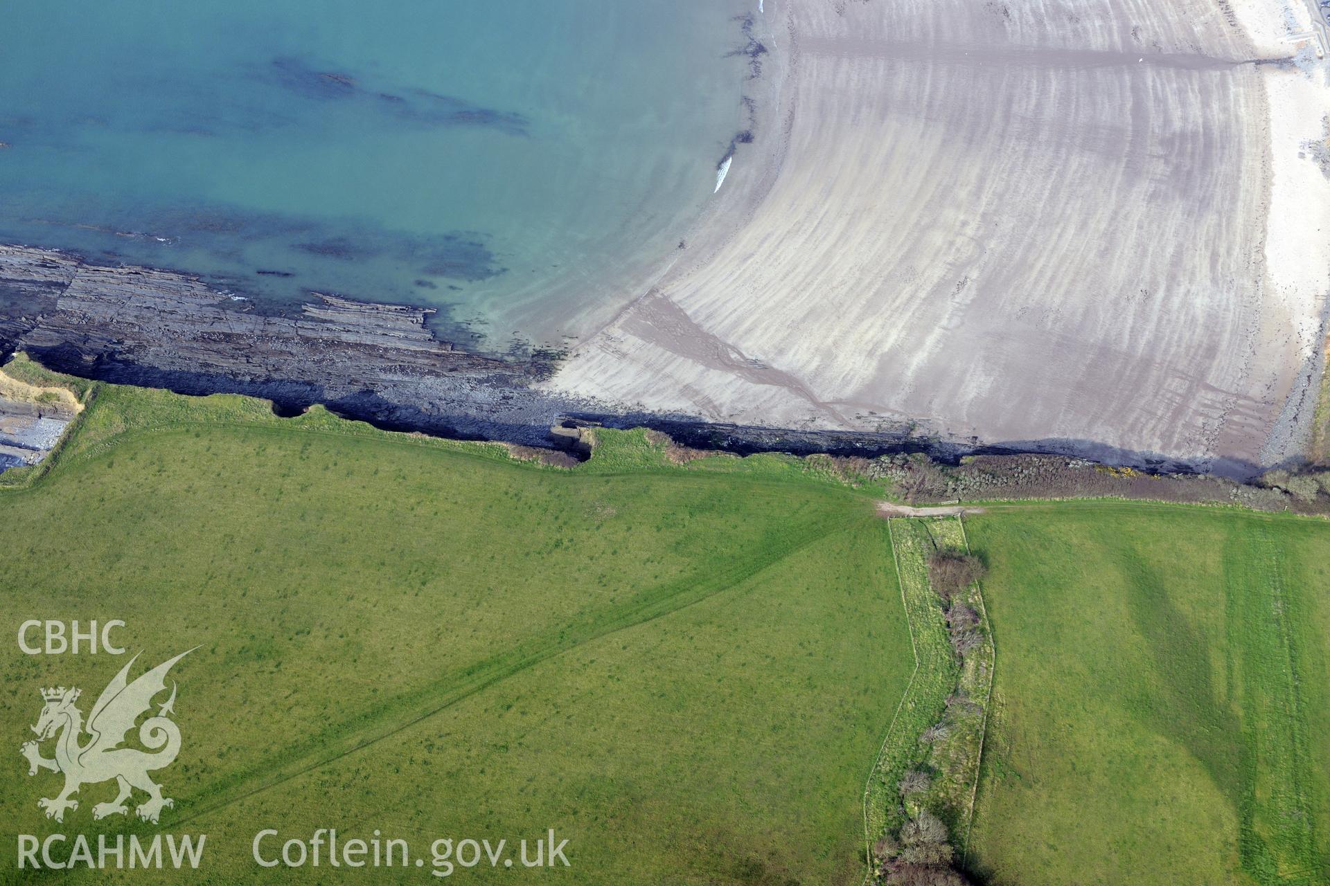 Royal Commission aerial photograph of West Angle Bay promontory fort taken on 27th March 2017. Baseline aerial reconnaissance survey for the CHERISH Project. ? Crown: CHERISH PROJECT 2017. Produced with EU funds through the Ireland Wales Co-operation Programme 2014-2020. All material made freely available through the Open Government Licence.