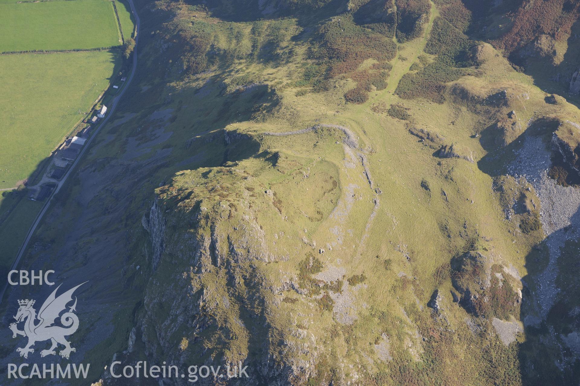 Hillfort on Bird's Rock, near Abergynolwyn. Oblique aerial photograph taken during the Royal Commission's programme of archaeological aerial reconnaissance by Toby Driver on 2nd October 2015.