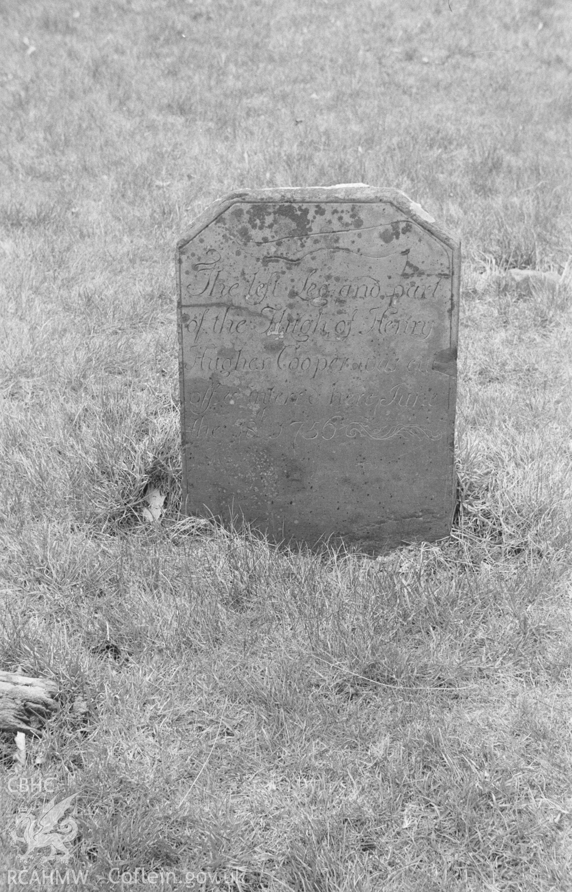 Digital copy of black & white negative showing gravestone for 'the left leg and part of the thigh of Henry Hughes, 1756' in St Mary's churchyard, Strata Florida Abbey. Photographed in April 1964 by Arthur O. Chater. SN 7465 6577, looking west.