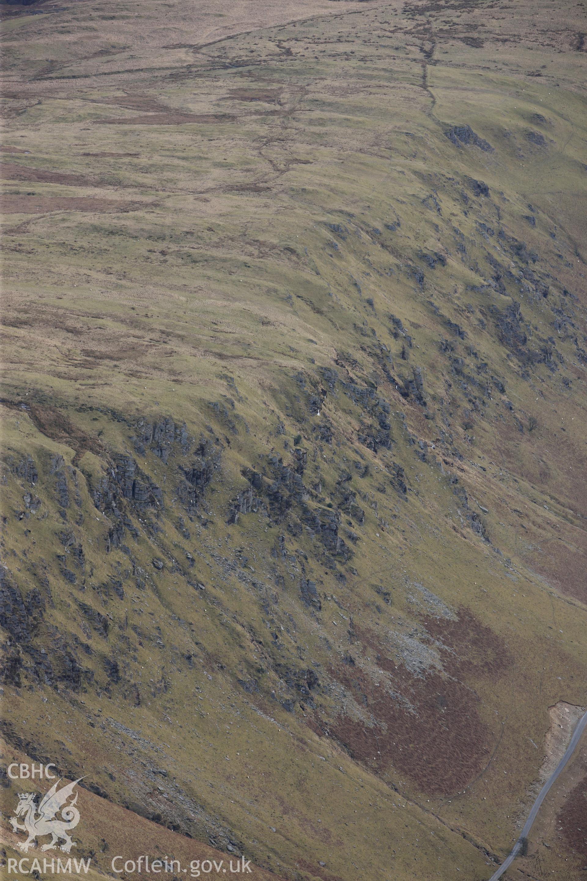 Esgair Irfon cairn in the Cambrian Mountains, north west of Llangurig. Oblique aerial photograph taken during the Royal Commission?s programme of archaeological aerial reconnaissance by Toby Driver on 28th February 2013.