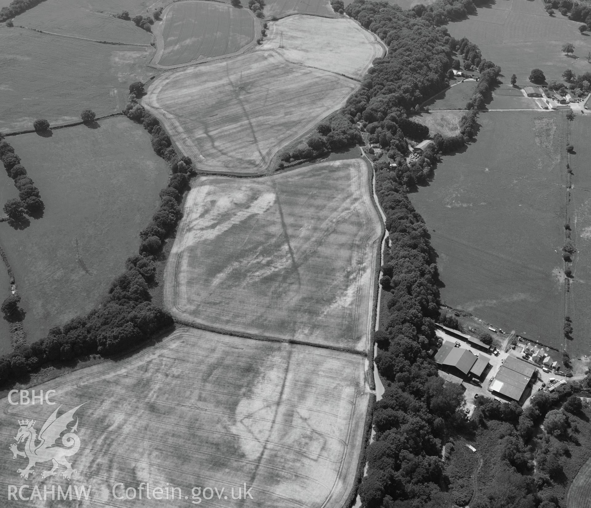 Malthouse Road defended enclosures, linear ditch, and Graig-yr-Eurych castle mound, north west of Caerleon. Oblique aerial photograph taken during the Royal Commission?s programme of archaeological aerial reconnaissance by Toby Driver on 1st August 2013.