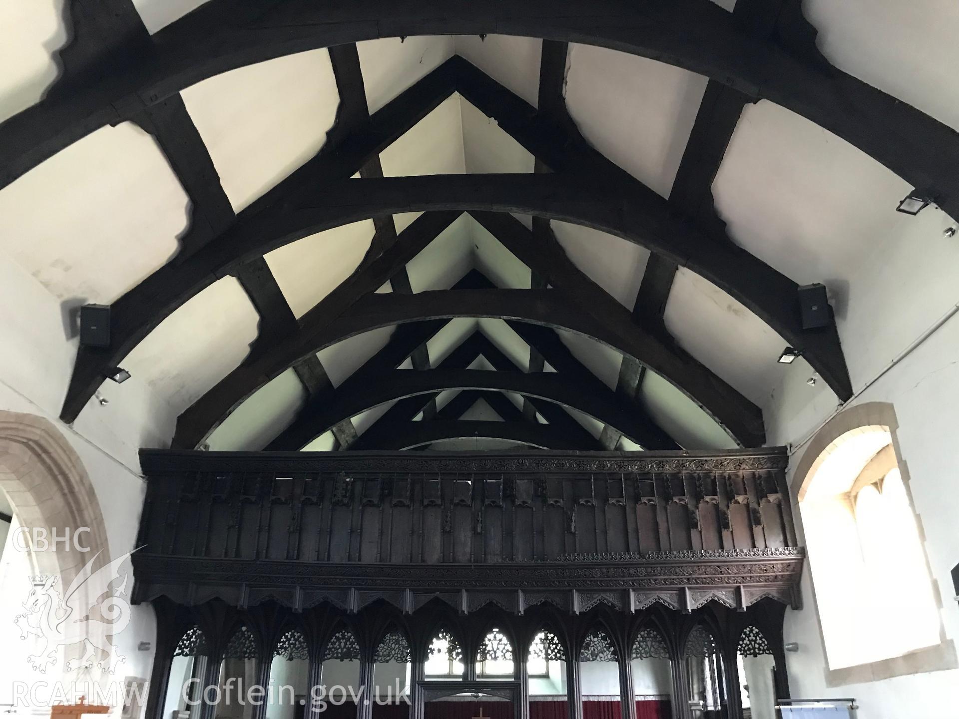 Colour photo showing interior of St. Grwst's Church, Llanrwst, including wooden beams and rood screen taken by Paul R. Davis, 23rd June 2018.