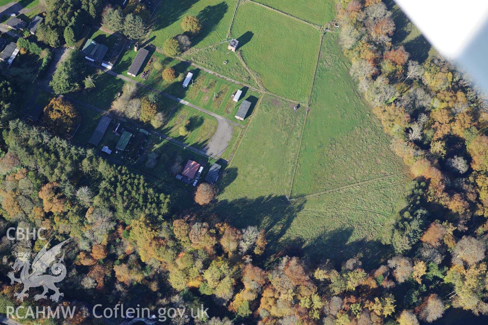 Henllan Bridge prisoner of war camp and site of Caerau hill fort, Henllan, near Newcastle Emlyn.  Oblique aerial photograph taken during the Royal Commission's programme of archaeological aerial reconnaissance by Toby Driver on 2nd November 2015.