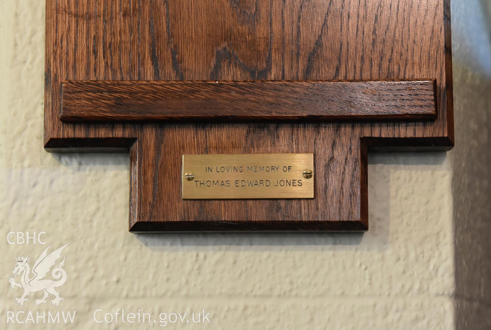 Detail of the bottom of the wooden hymn board at Hyssington Primitive Methodist Chapel, Hyssington, Churchstoke. Photographic survey conducted by Sue Fielding on 7th December 2018. Transcription: IN LOVING MEMORY OF/ THOMAS EDWARD JONES