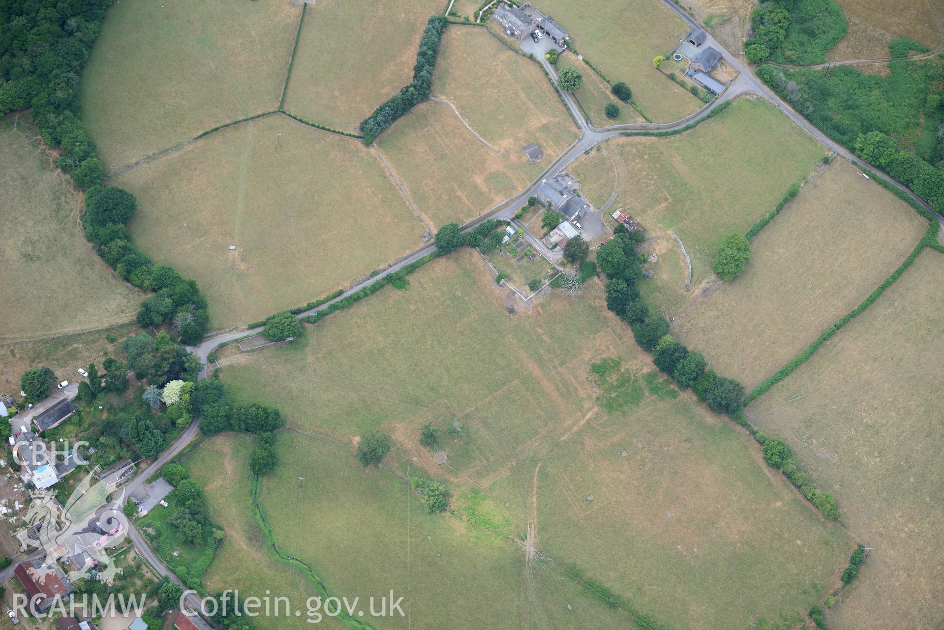 Royal Commission aerial photography of extensive parchmarks at Pen y Gaer Roman fort, including the internal plan and extramural buildings, taken on 19th July 2018 during the 2018 drought.