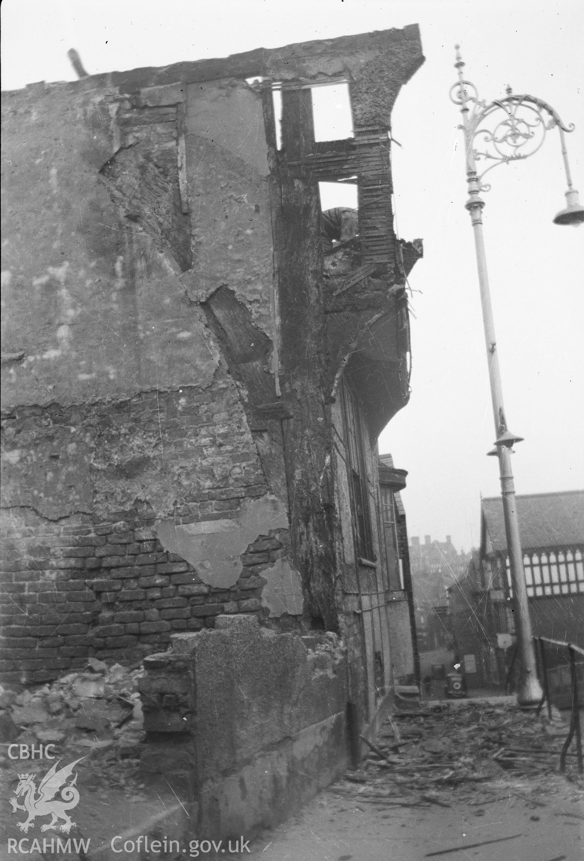Digital copy of a nitrate negative showing An unidentified building in Wrexham - demolition in progress, taken by RCAHMW.