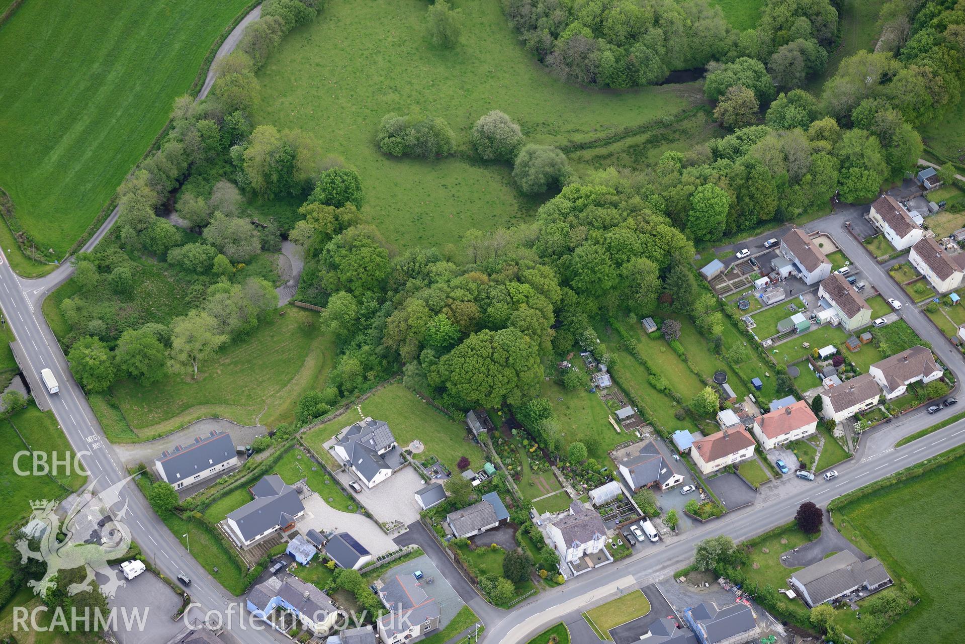Llanwnnen castle and village. Oblique aerial photograph taken during the Royal Commission's programme of archaeological aerial reconnaissance by Toby Driver on 3rd June 2015.